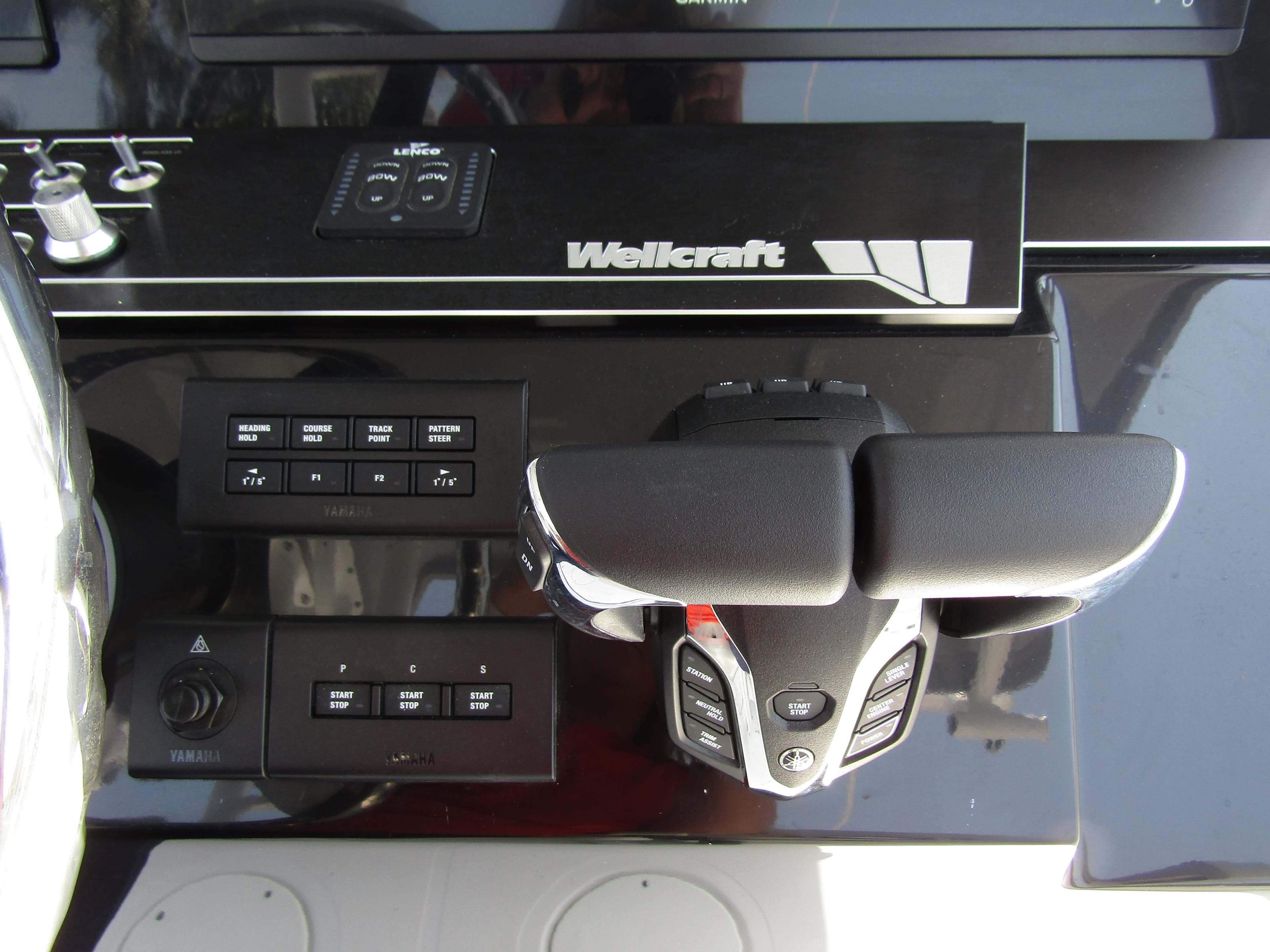 2024 Wellcraft 352 Fisherman boat control panel and throttle.