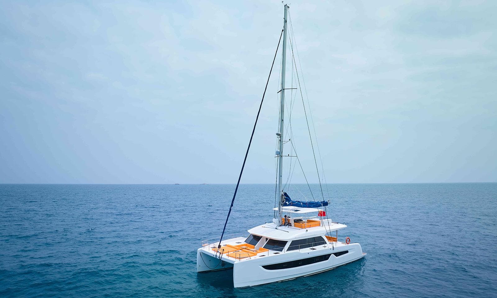 Luxury Heysea 59 catamaran sailing on open sea, 2026 model.
