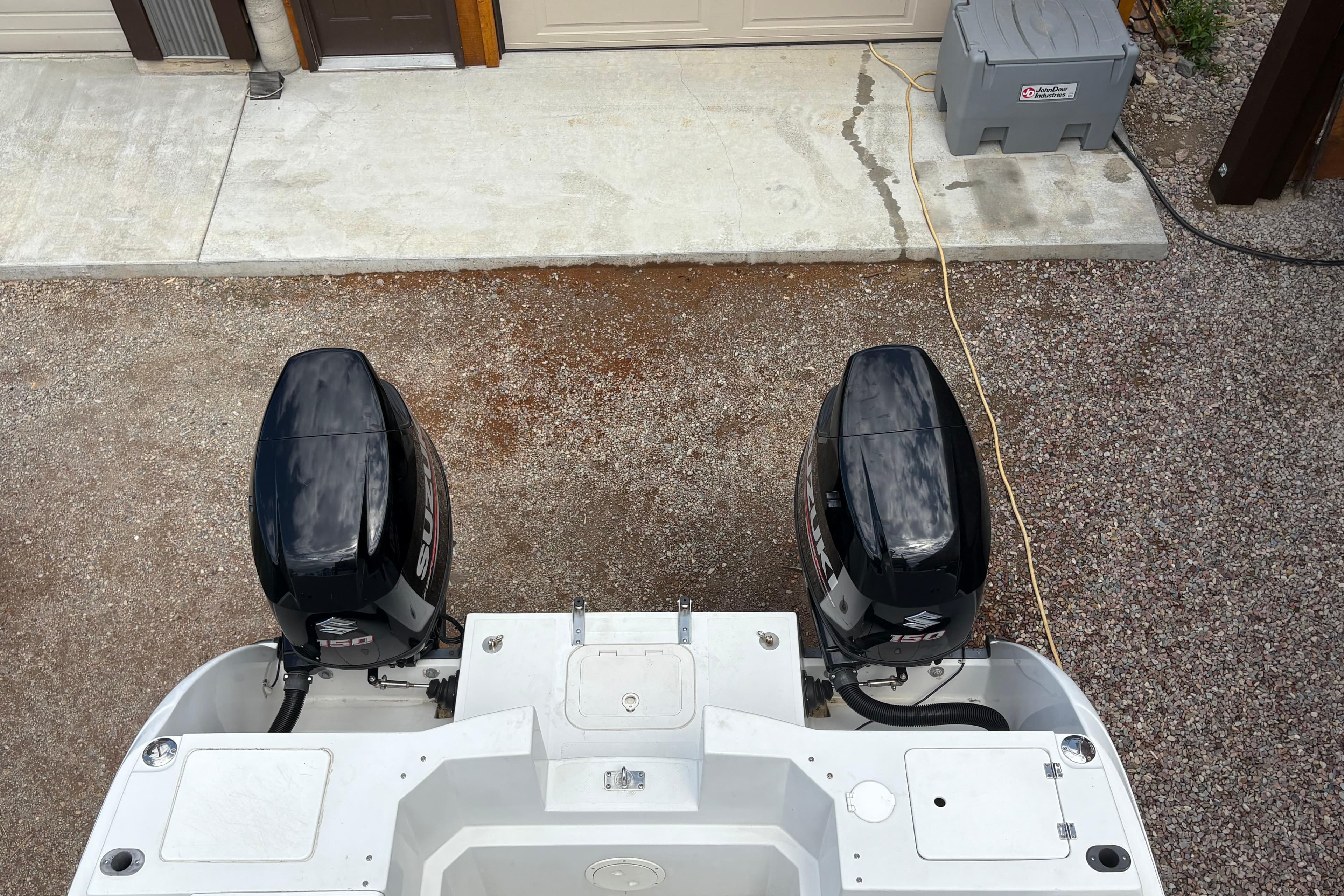 Top view of a 2001 Glacier Bay 2690 Coastal Runner with dual outboard motors.