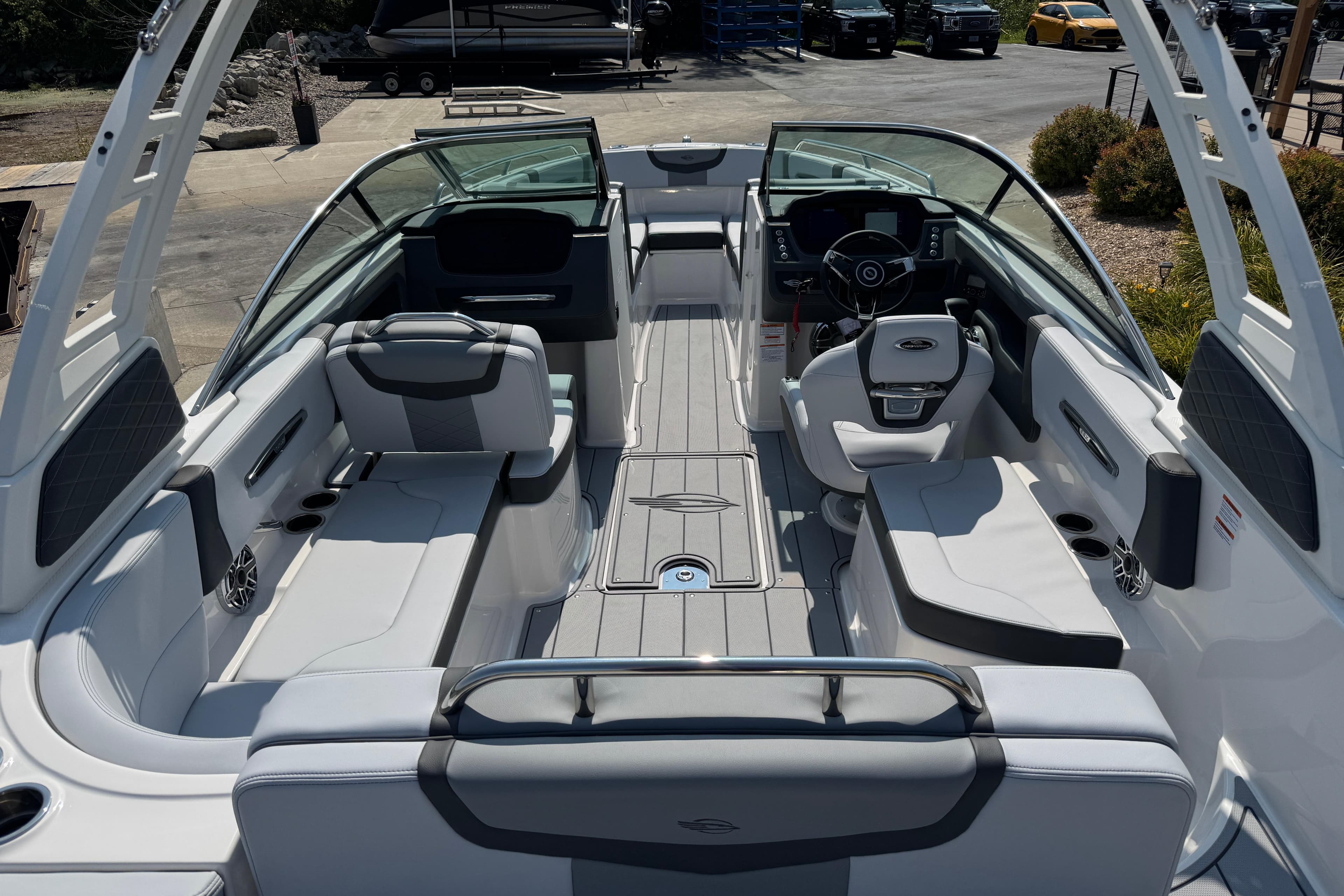 2025 Chaparral 247 SSX boat interior with sleek seating and modern dashboard design.