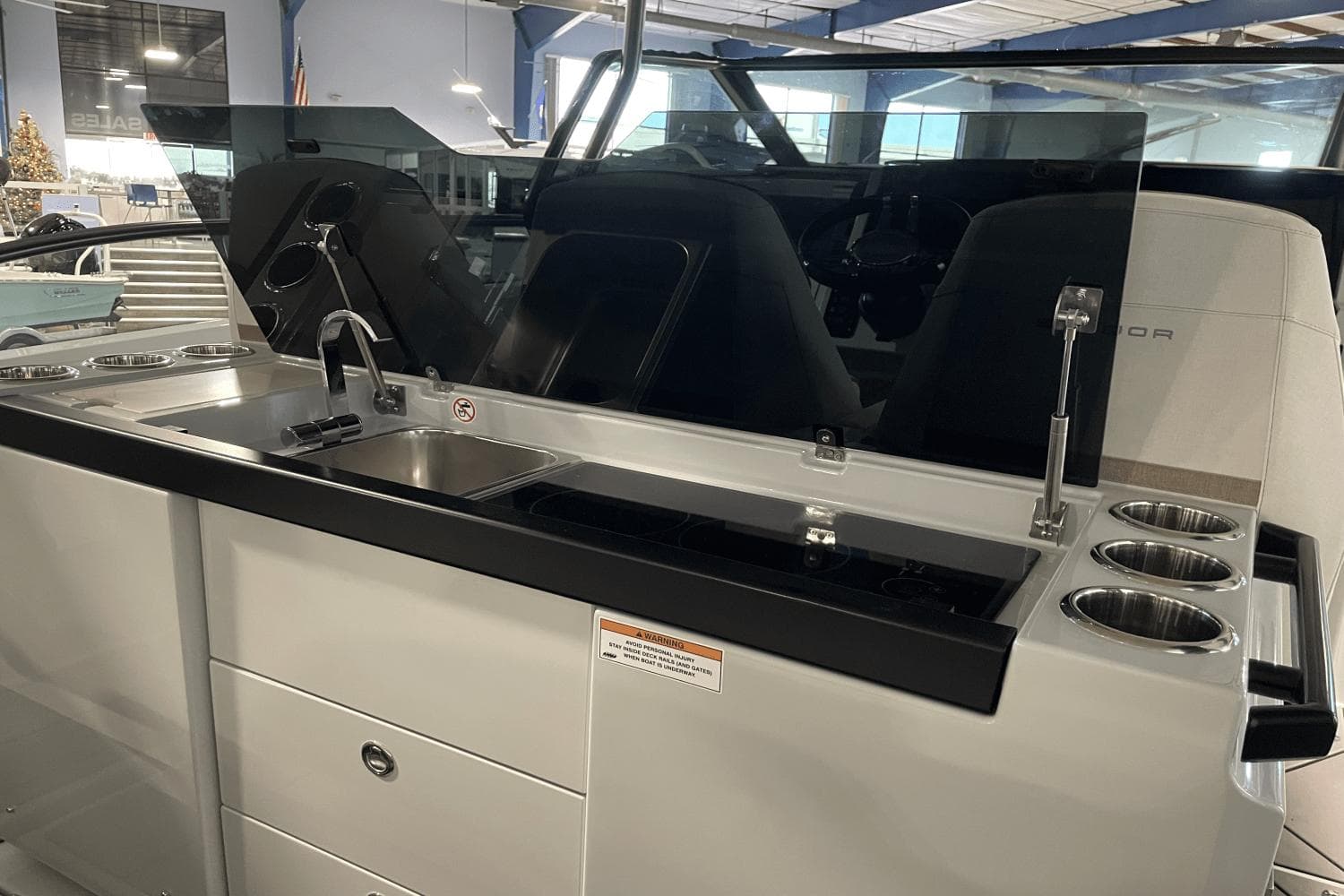 2024 Saxdor 320 GTO boat interior with sleek kitchen sink and modern design.