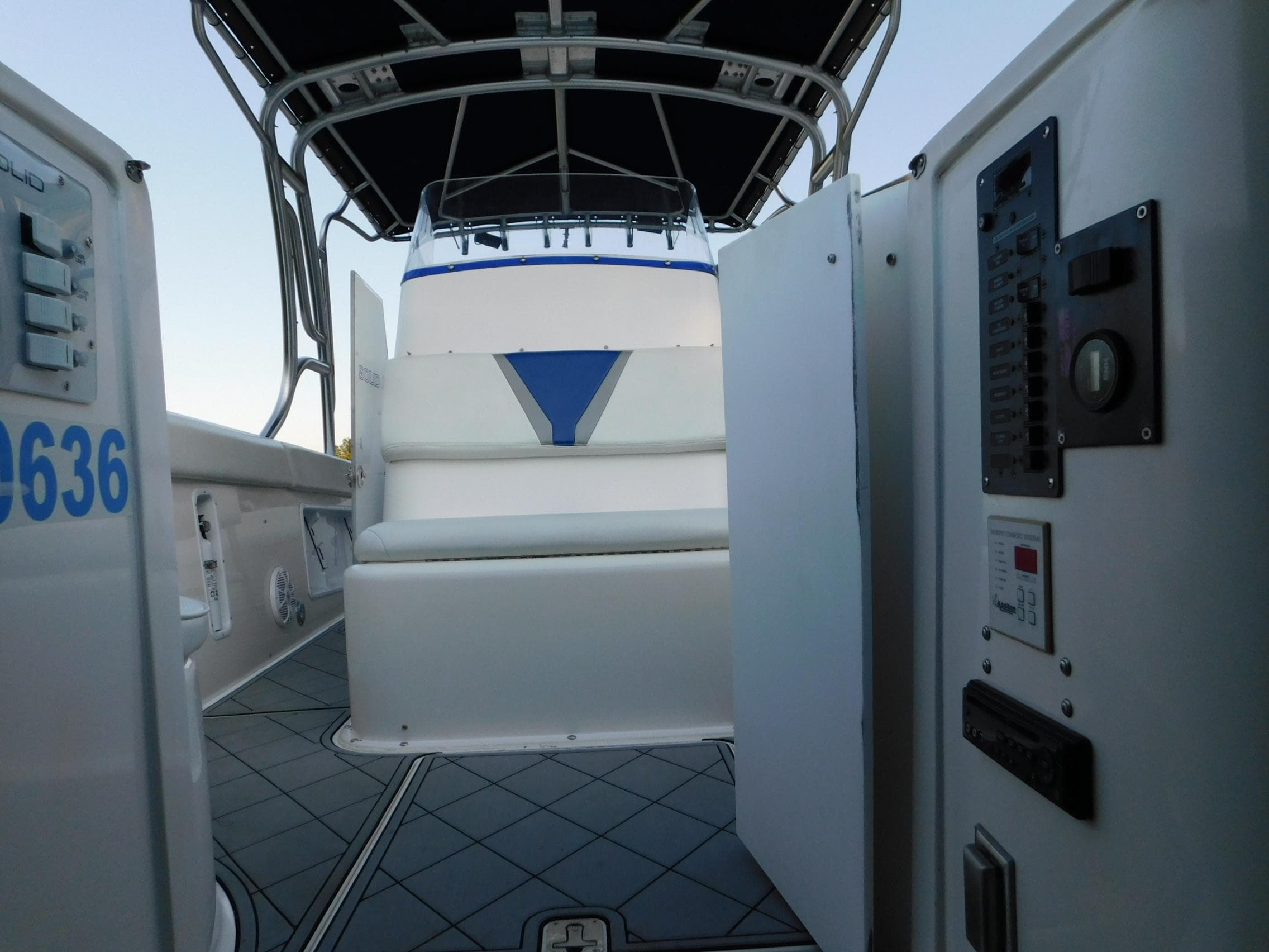 Interior view of 2005 Solid Craft LIMITED 40 boat with seating and control panel.