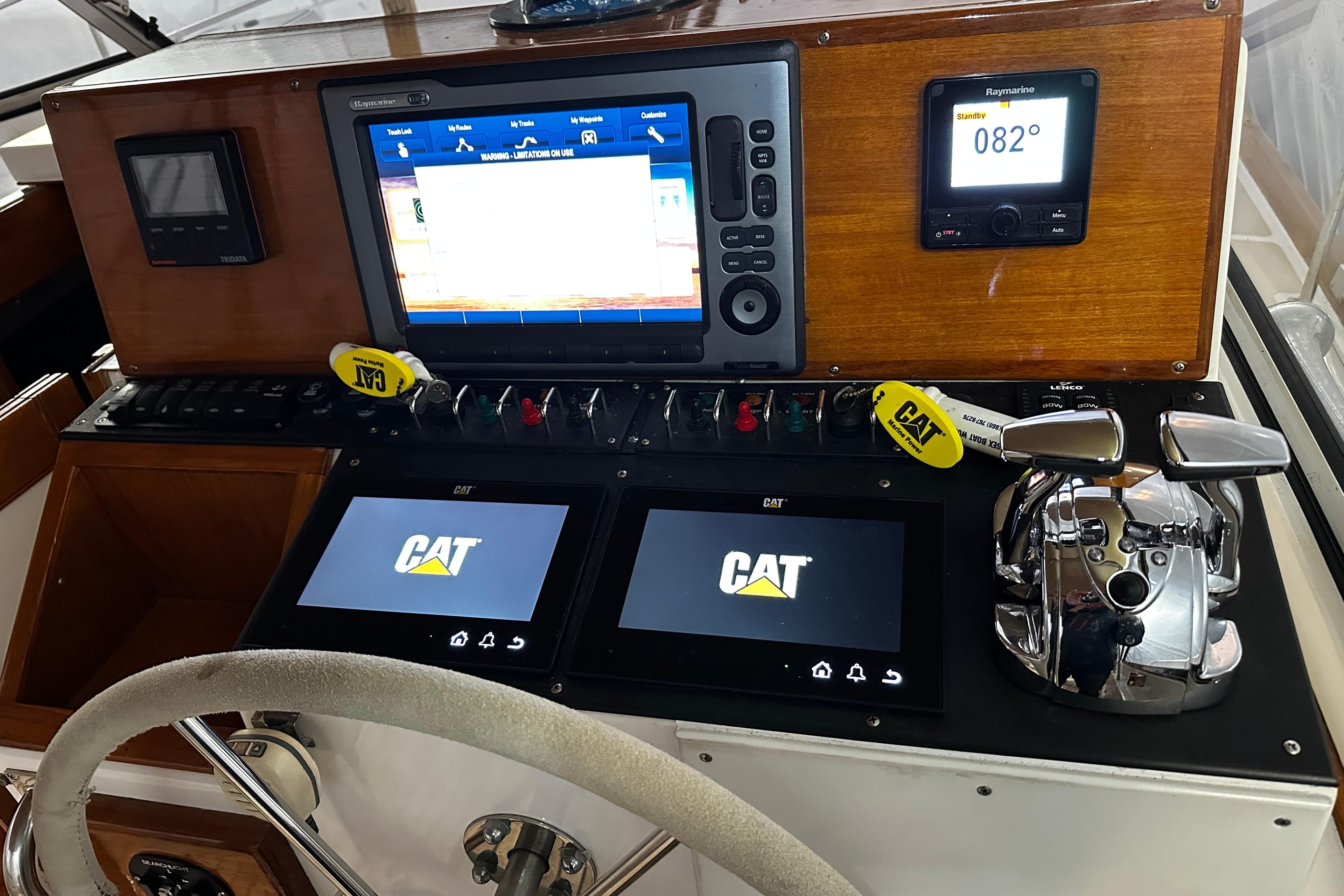 Helm of 1995 Grand Banks 38 Eastbay EX with navigation and control systems.