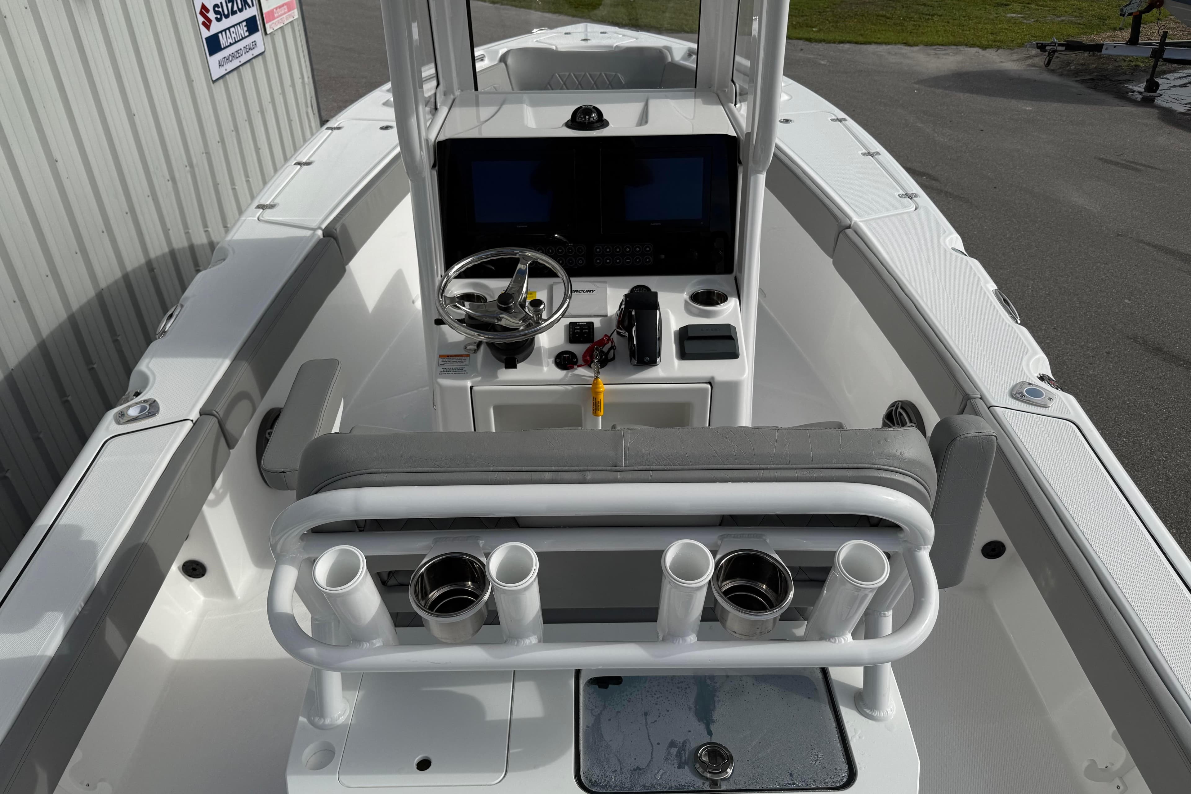 2026 Blazer Bay Makaira 2600 boat interior with steering console and rod holders.