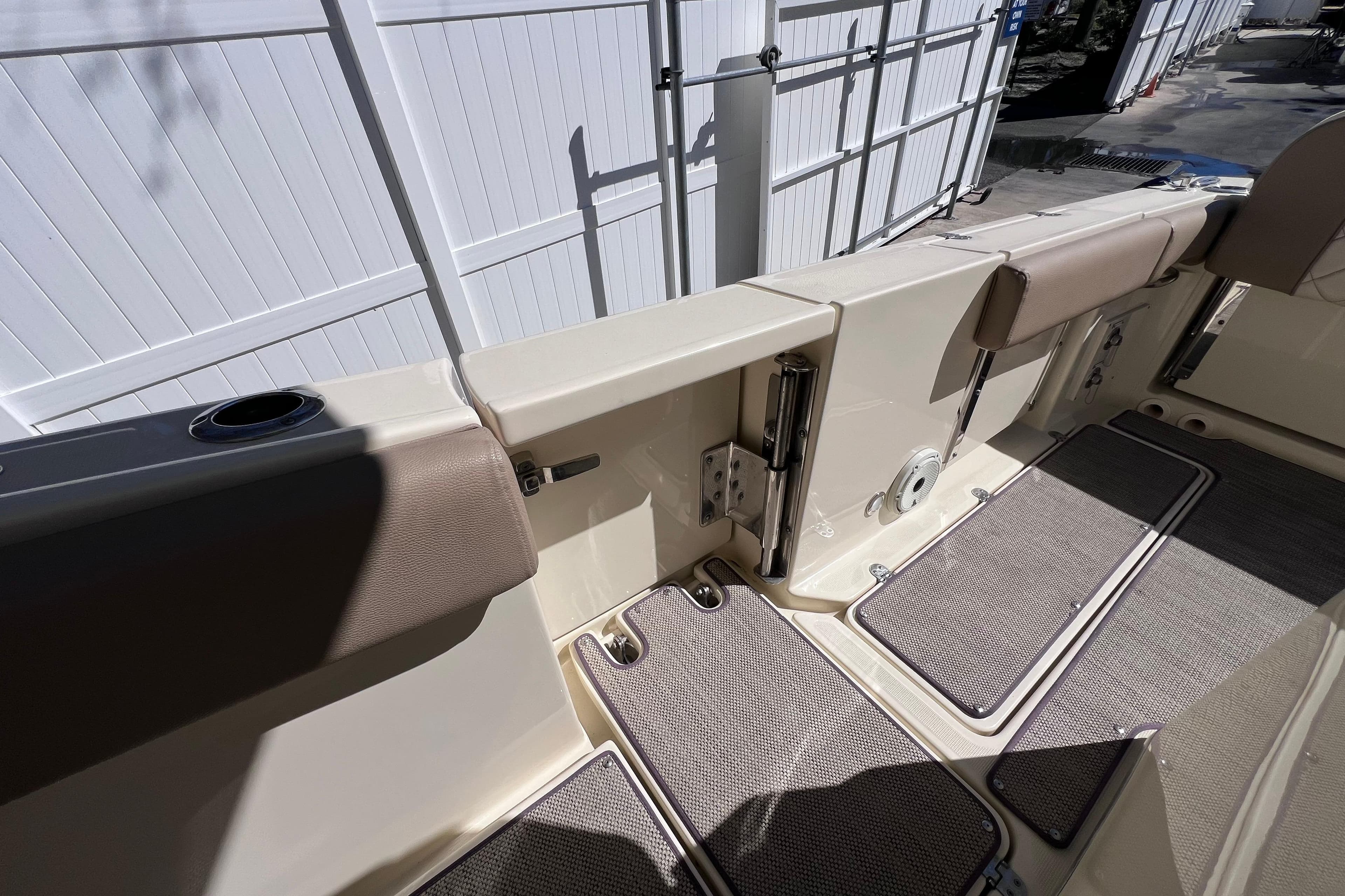 2022 Chris-Craft Catalina 30 boat interior with cushioned seating and deck mats.