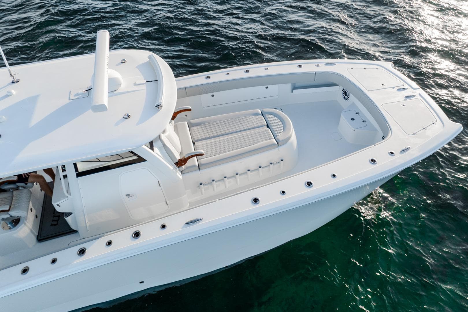 2023 Freeman 43 boat on water, featuring sleek white design and spacious deck.