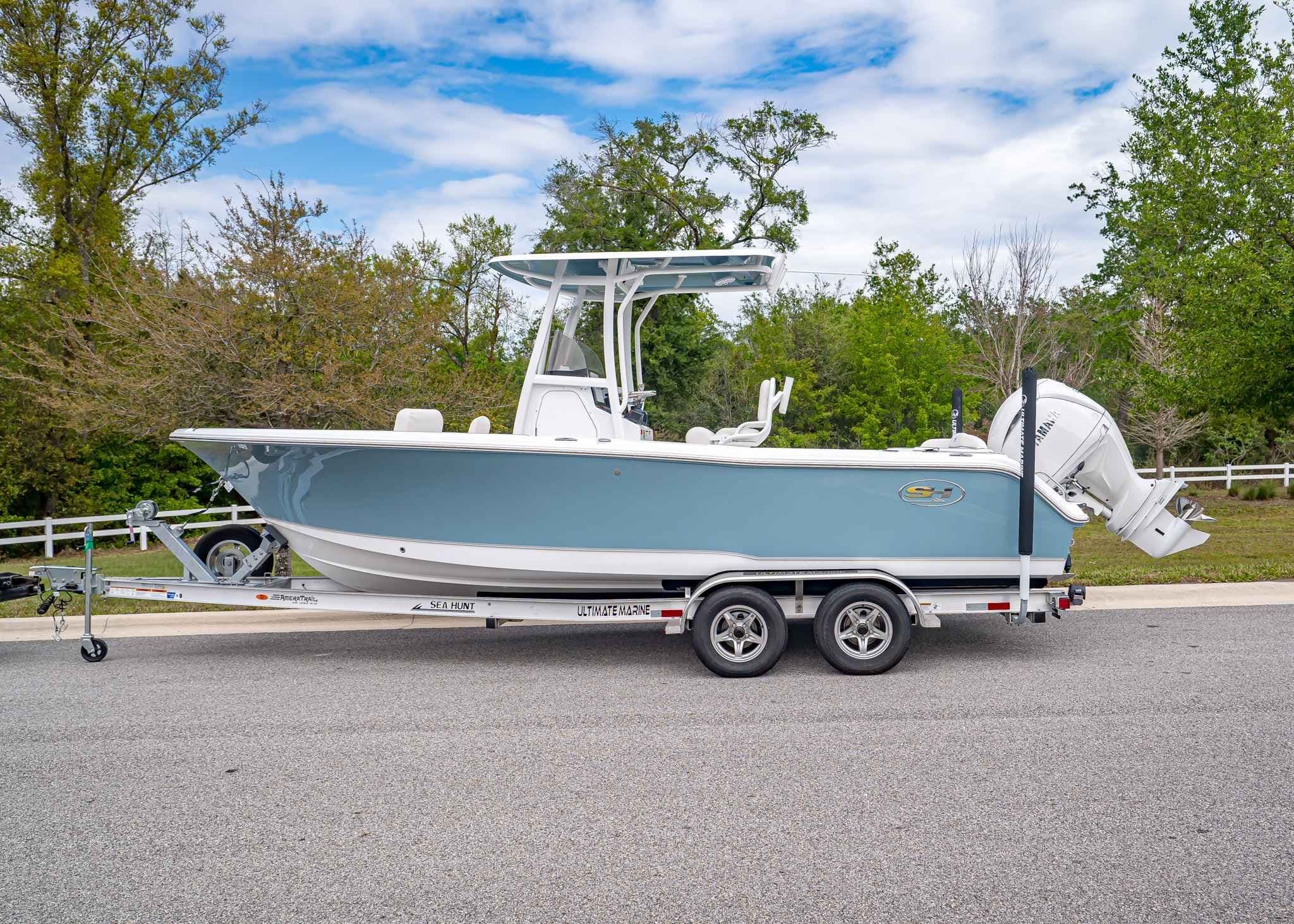 2026 Sea Hunt Ultra 229 boat on trailer, side view.