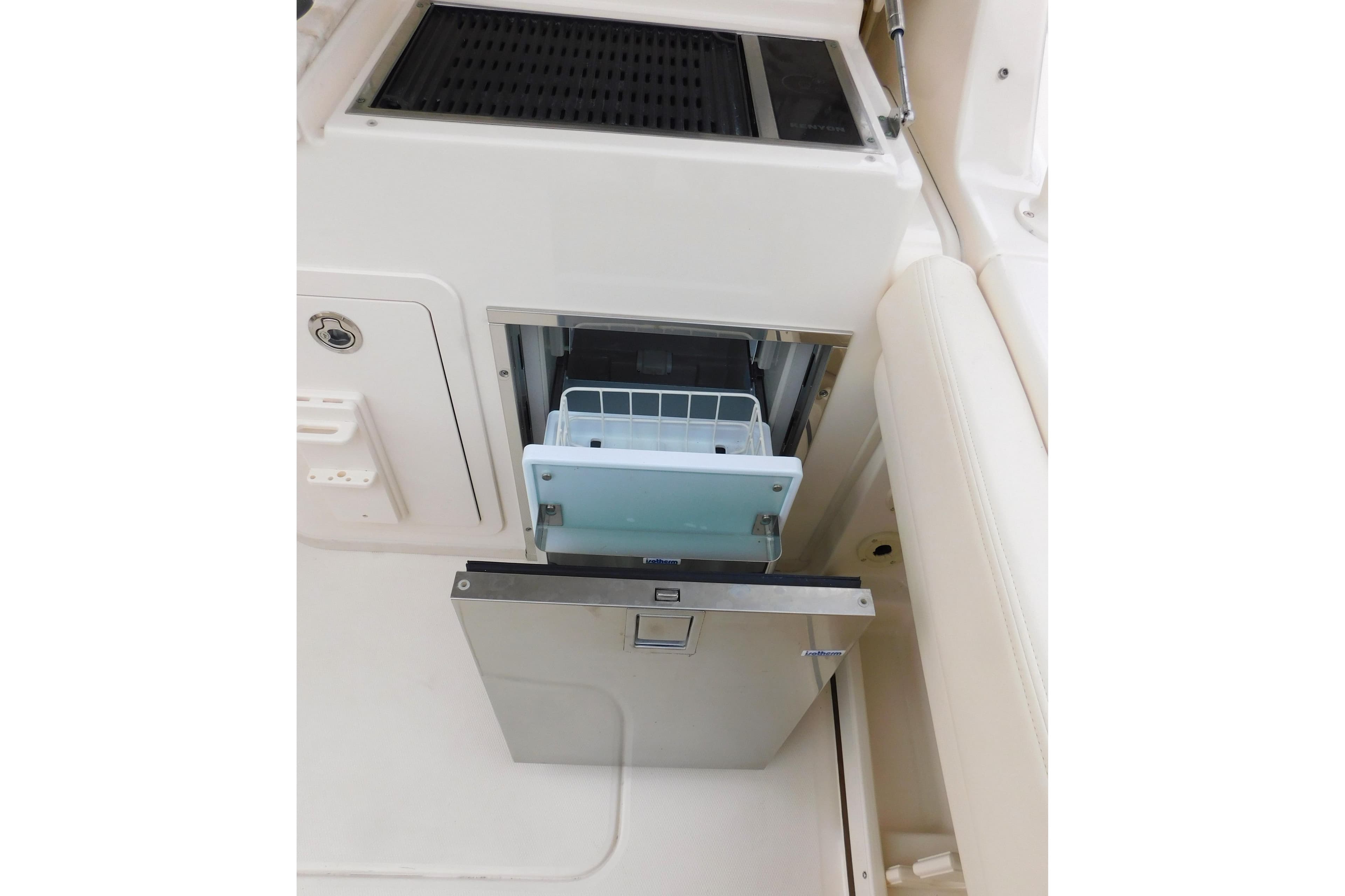 2016 Grady-White Freedom 307 boat interior with open storage compartment.