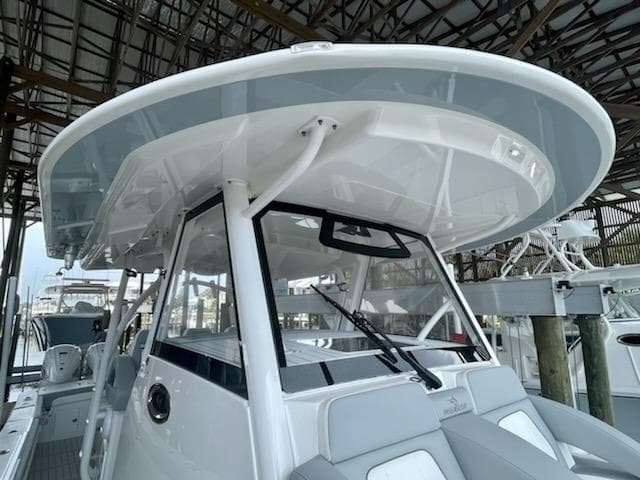 2020 Regulator 41 boat with hardtop and seating, docked in a marina.