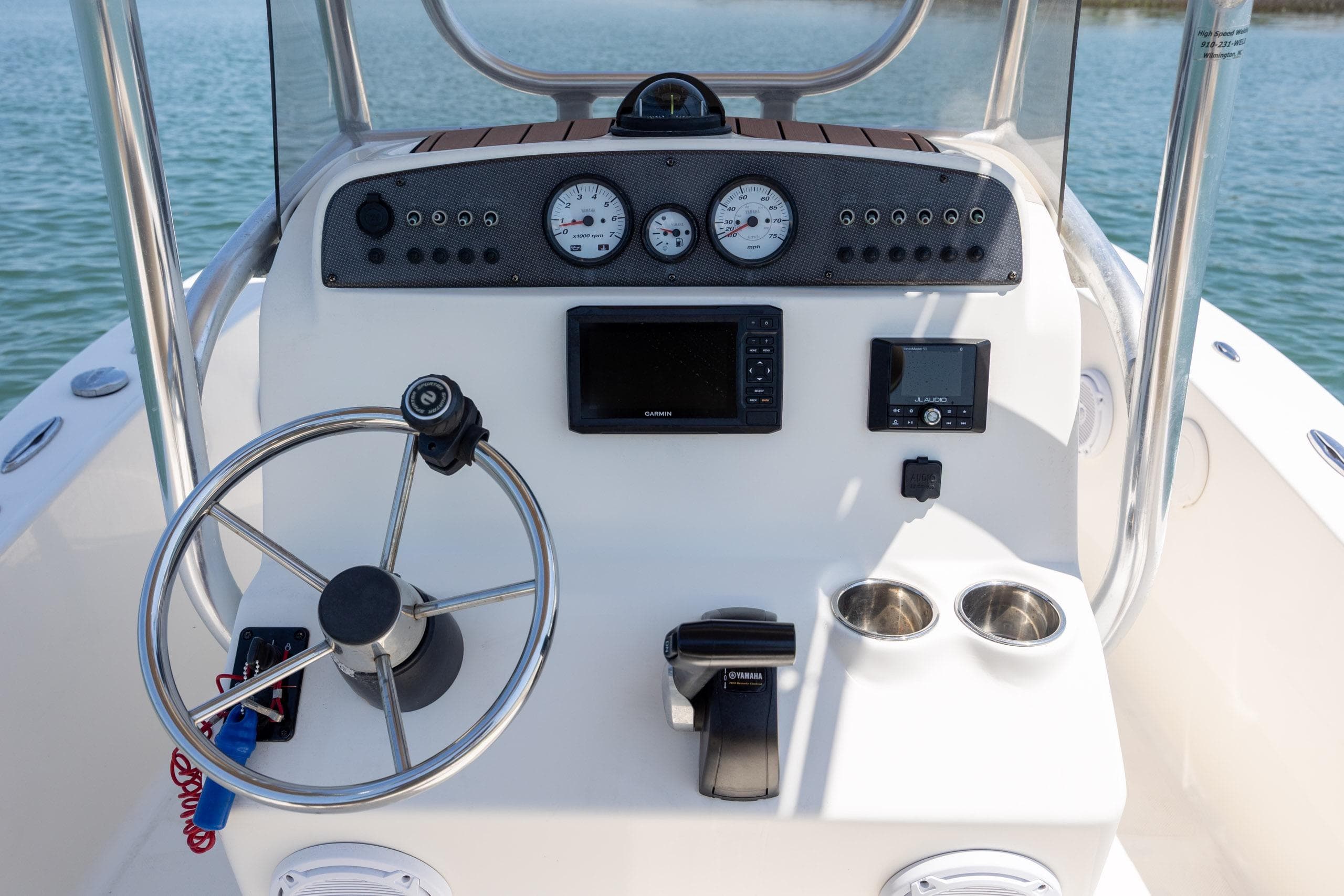 Control panel of 2019 Pioneer 180 Islander boat with steering wheel and gauges.