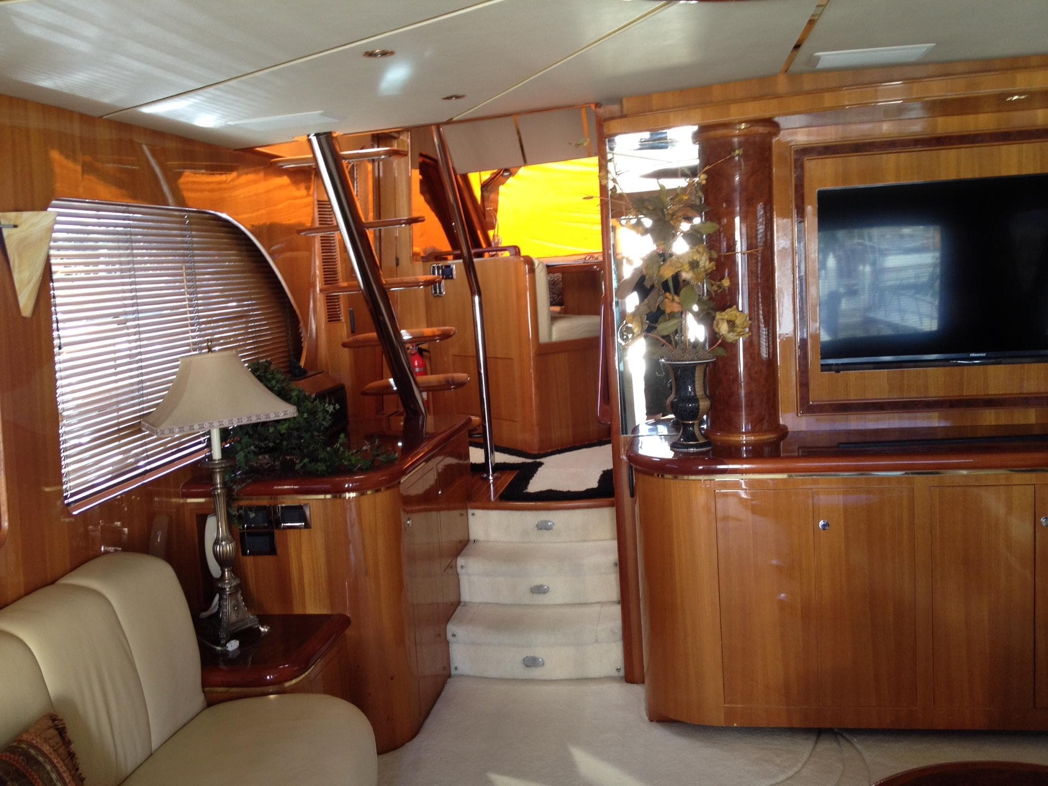 Luxurious interior of 2004 Ocean Alexander 548 Pilothouse yacht with wooden finishes and modern amenities.