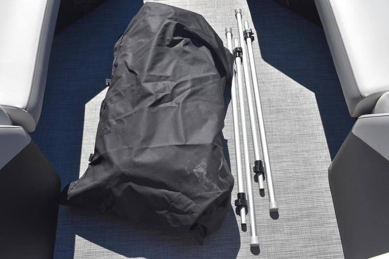 Boat interior with black bag and metal poles, Lowe SS 230, 2026 model.