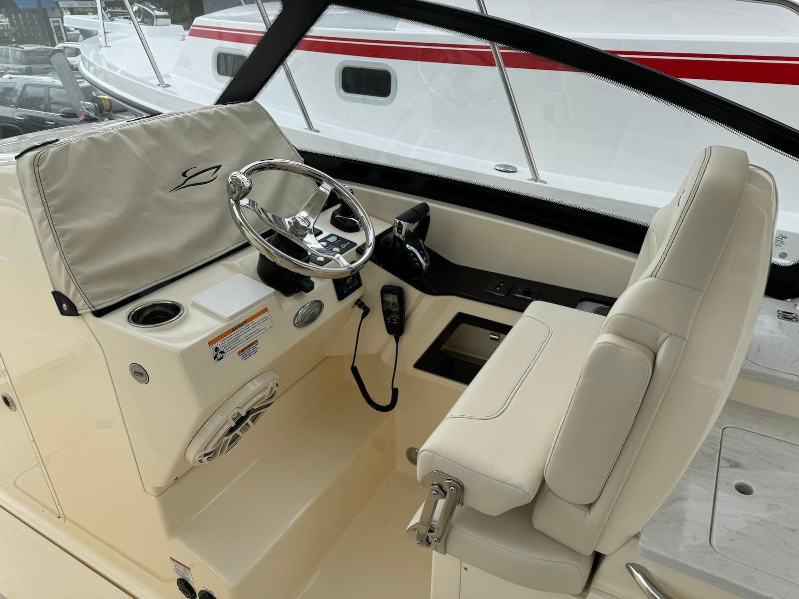 2025 Scout 277 Dorado boat helm with steering wheel and controls.