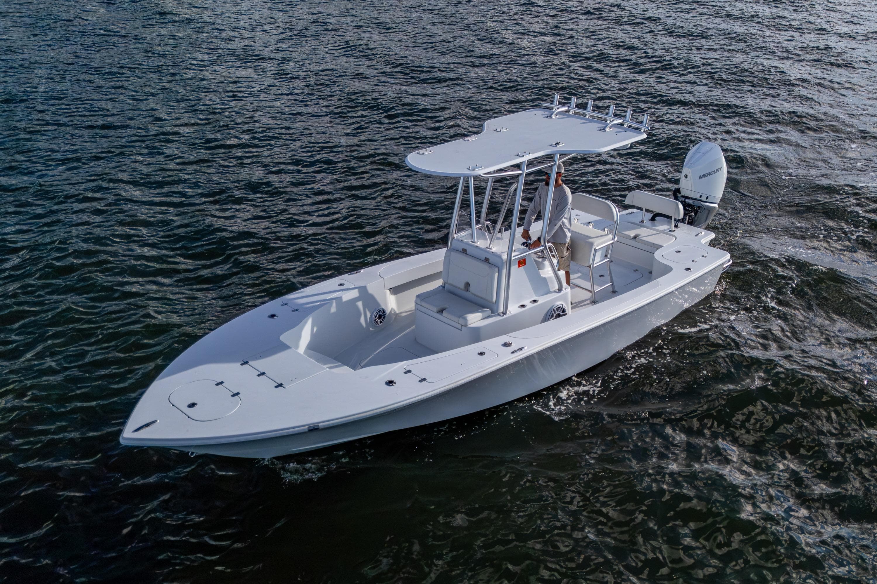 2022 Conch 25 boat cruising on open water, featuring sleek design and modern outboard motor.
