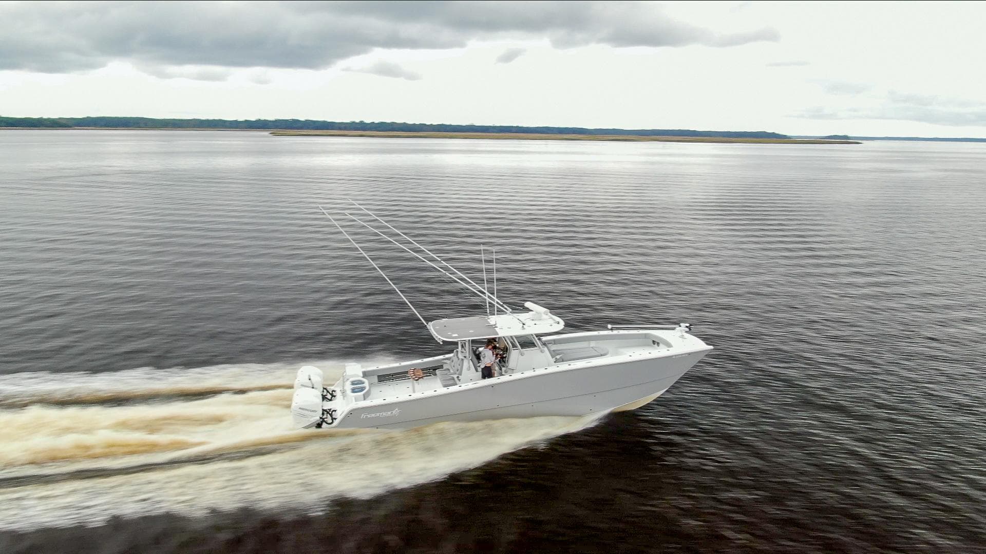 Freeman 42LR boat cruising on open water, 2020 model, overcast sky.