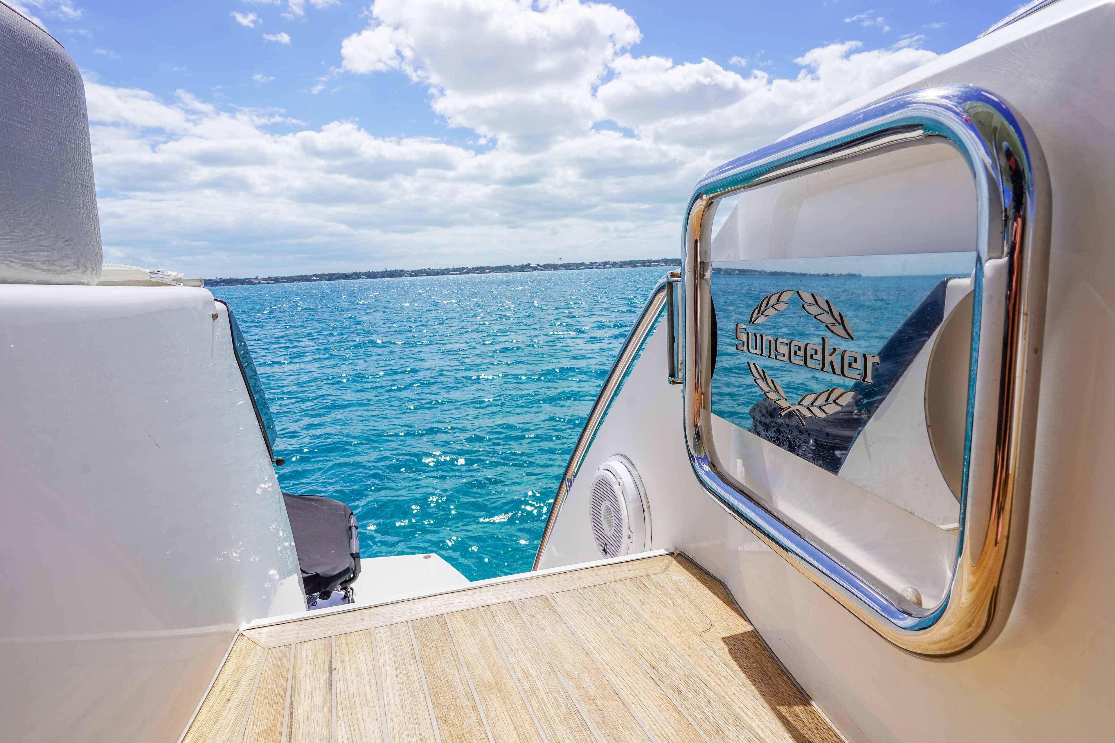 Sunseeker 75 Yacht 2016, rear deck view with ocean backdrop.