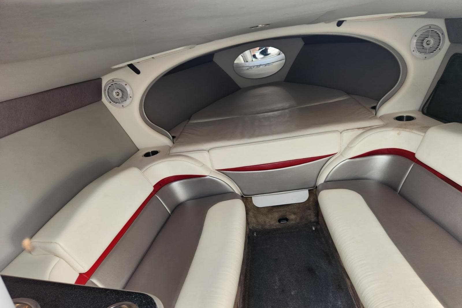 2008 Formula 292 FASTech cabin interior with white and red seating, speakers, and cozy layout.