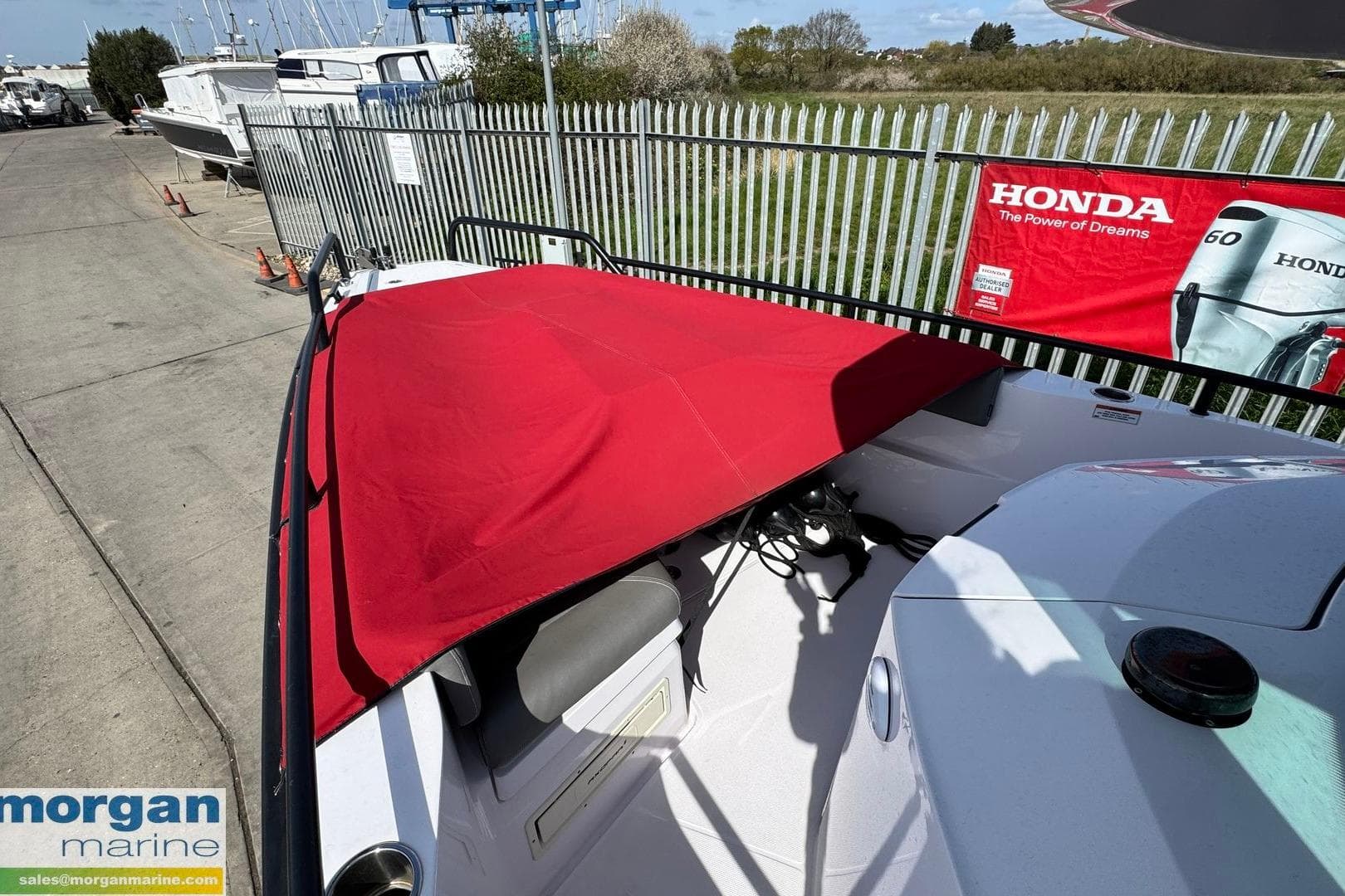 2021 Axopar 28 Cabin boat with red cover at Morgan Marine dealership.