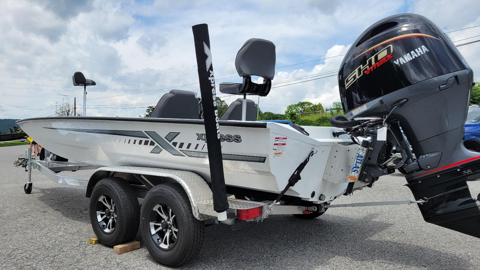 2026 Xpress H20 Bass boat with Yamaha Vmax 175 engine, parked on a trailer.