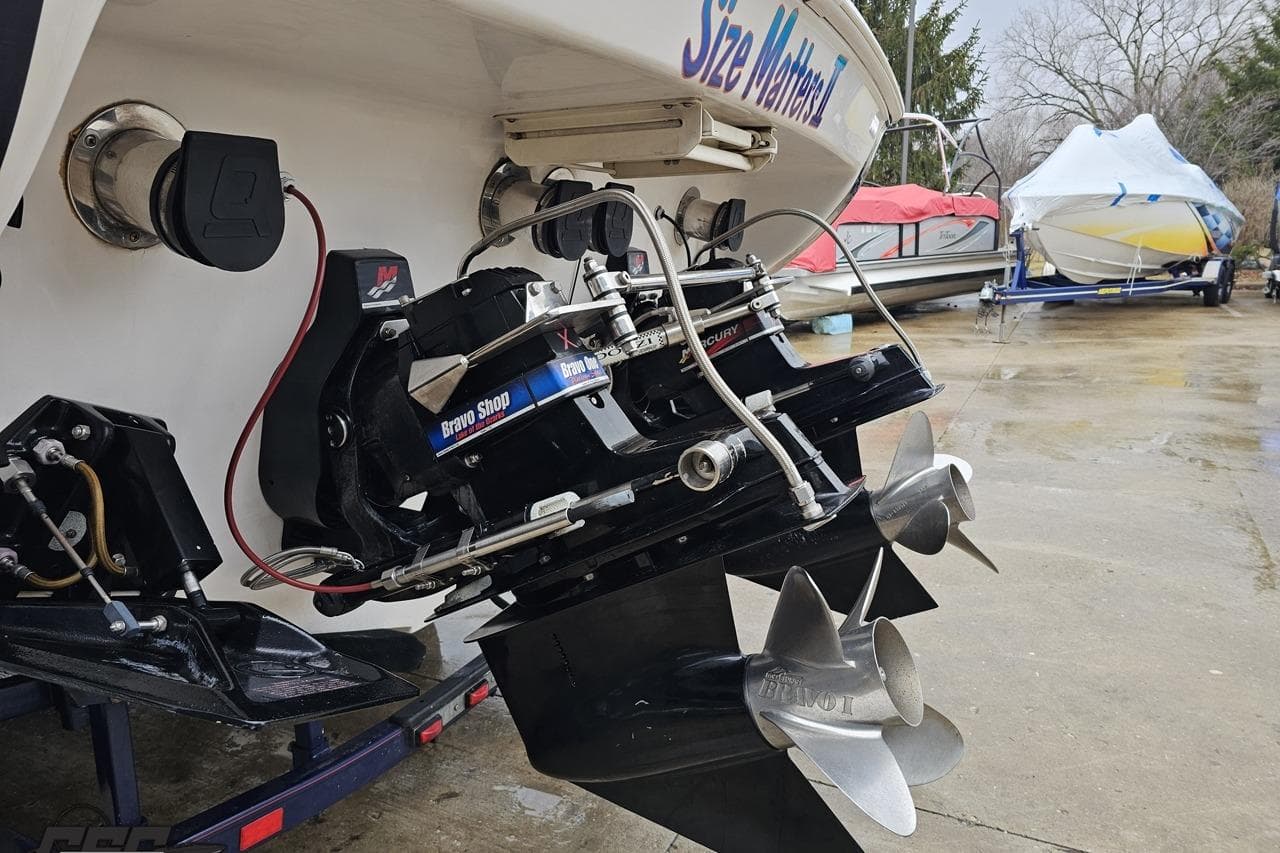 2000 Donzi 33 ZX boat with Bravo Shop outdrive, docked on a trailer.