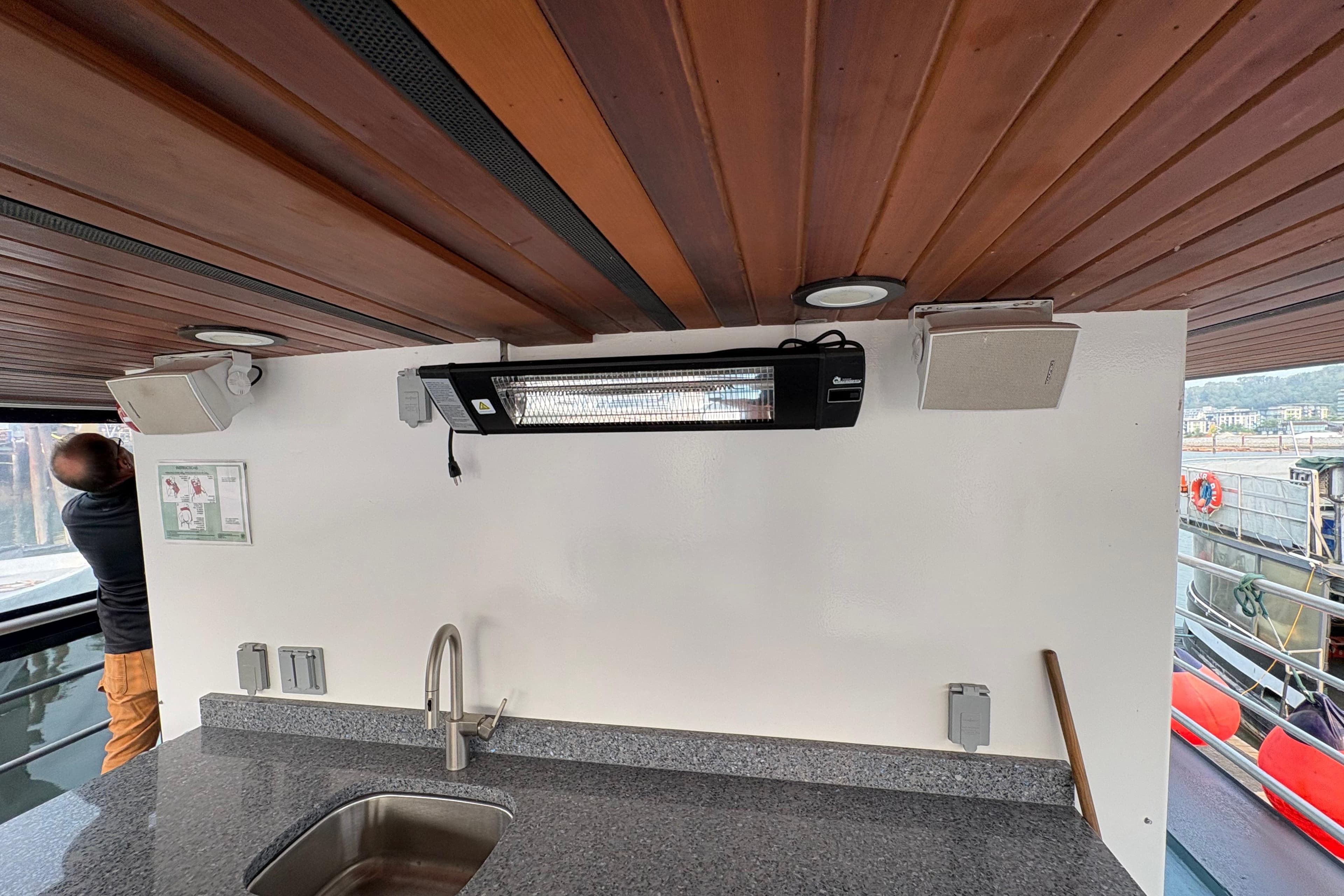 Interior of a 1941 McKenzie Barge tugboat with modern sink and heater.