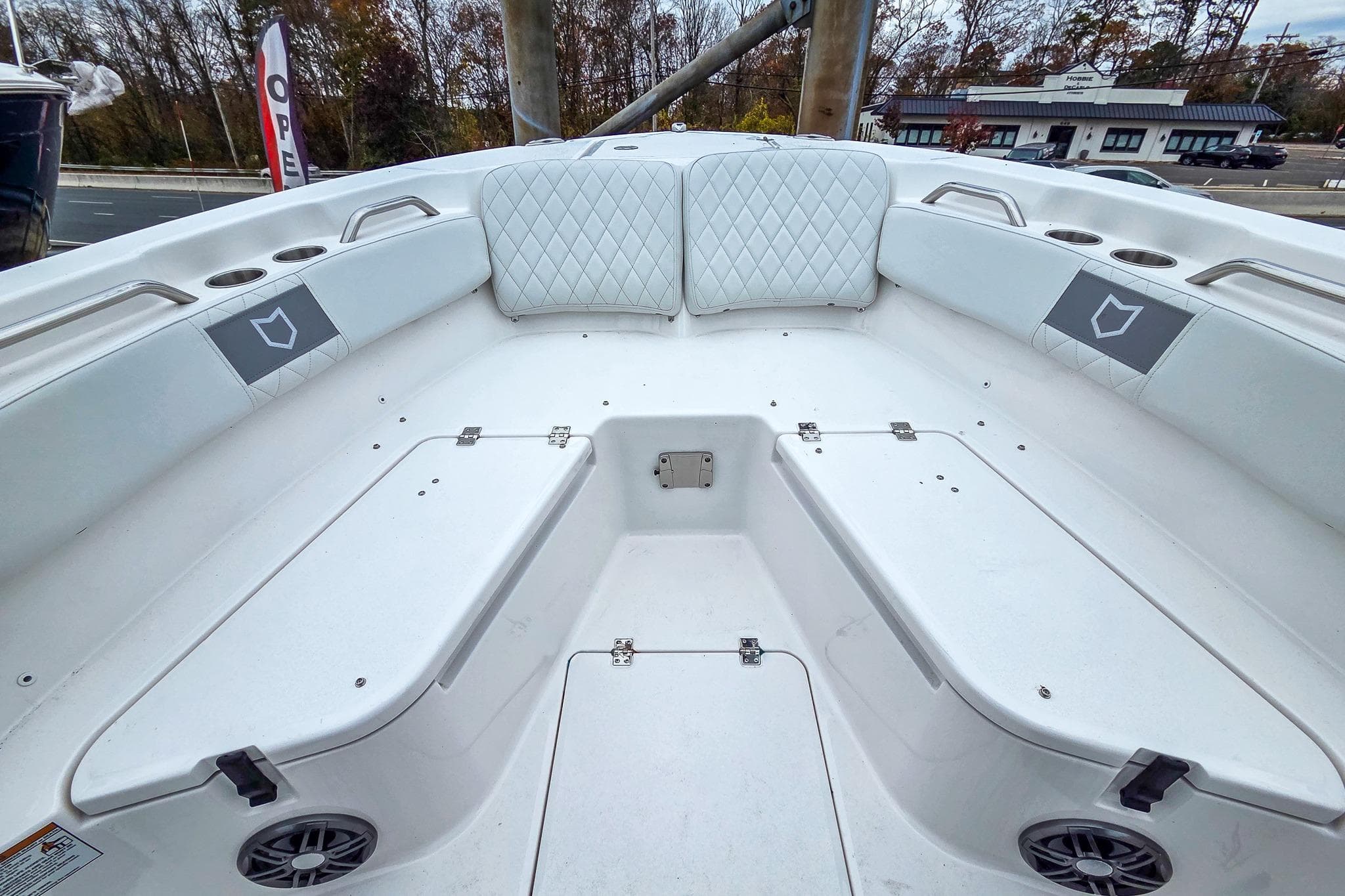 2026 Sea Fox 228 Commander boat interior with white seating and cup holders.