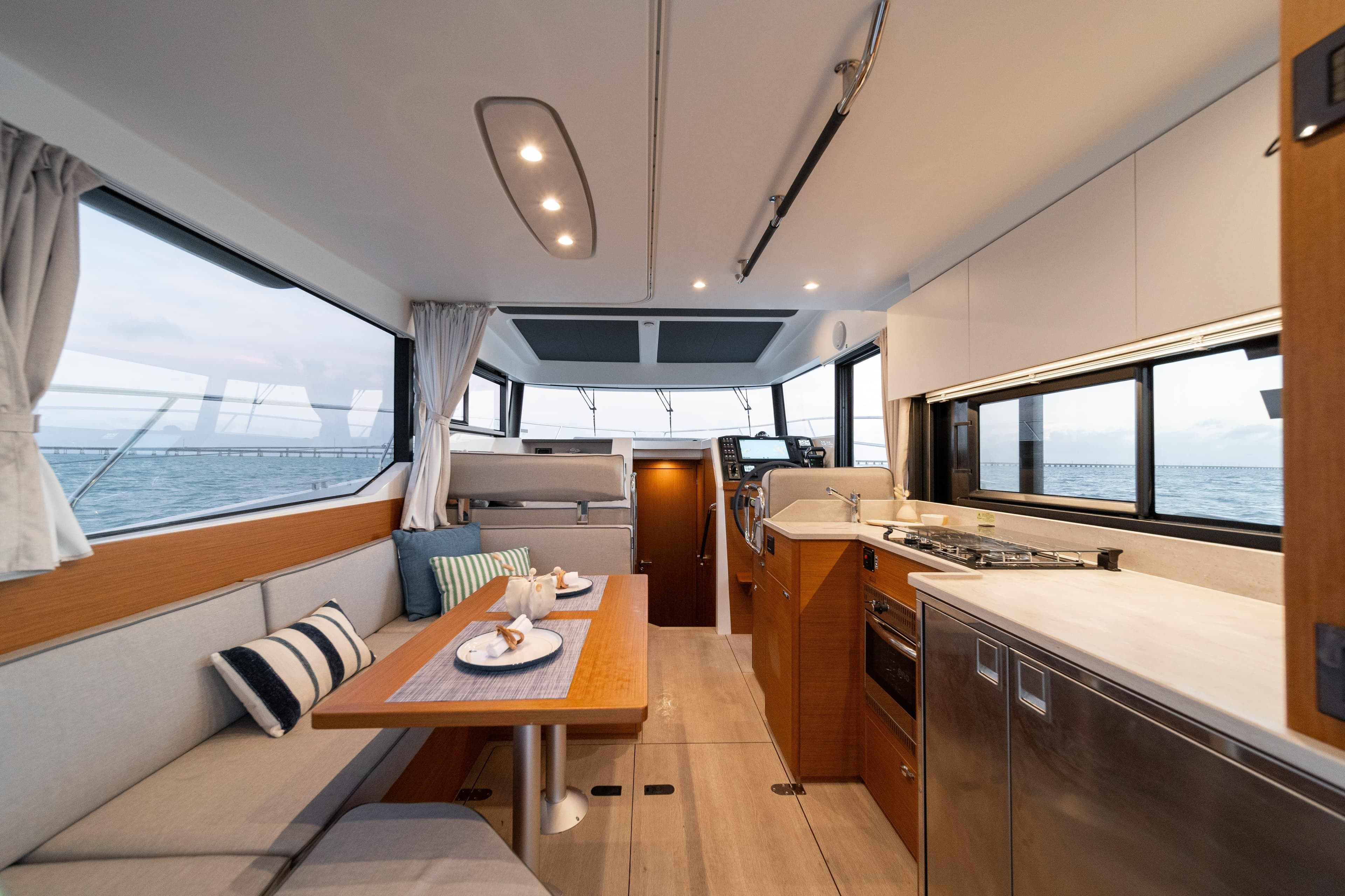 Interior of 2026 Beneteau Swift Trawler 37 Fly, featuring modern kitchen and dining area.