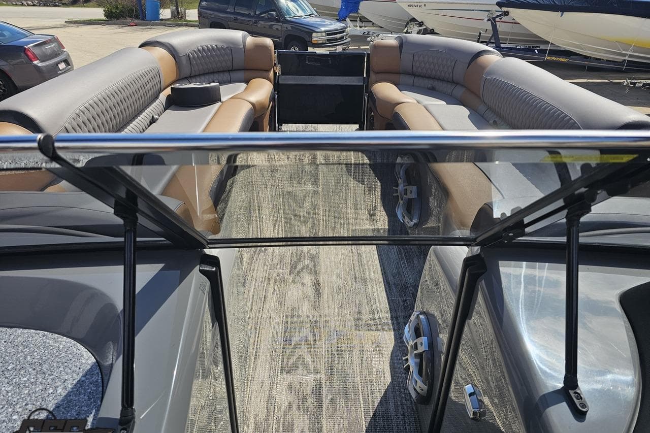 2024 Avalon Excalibur Quad Lounge Windshield boat interior with luxurious seating and modern design.