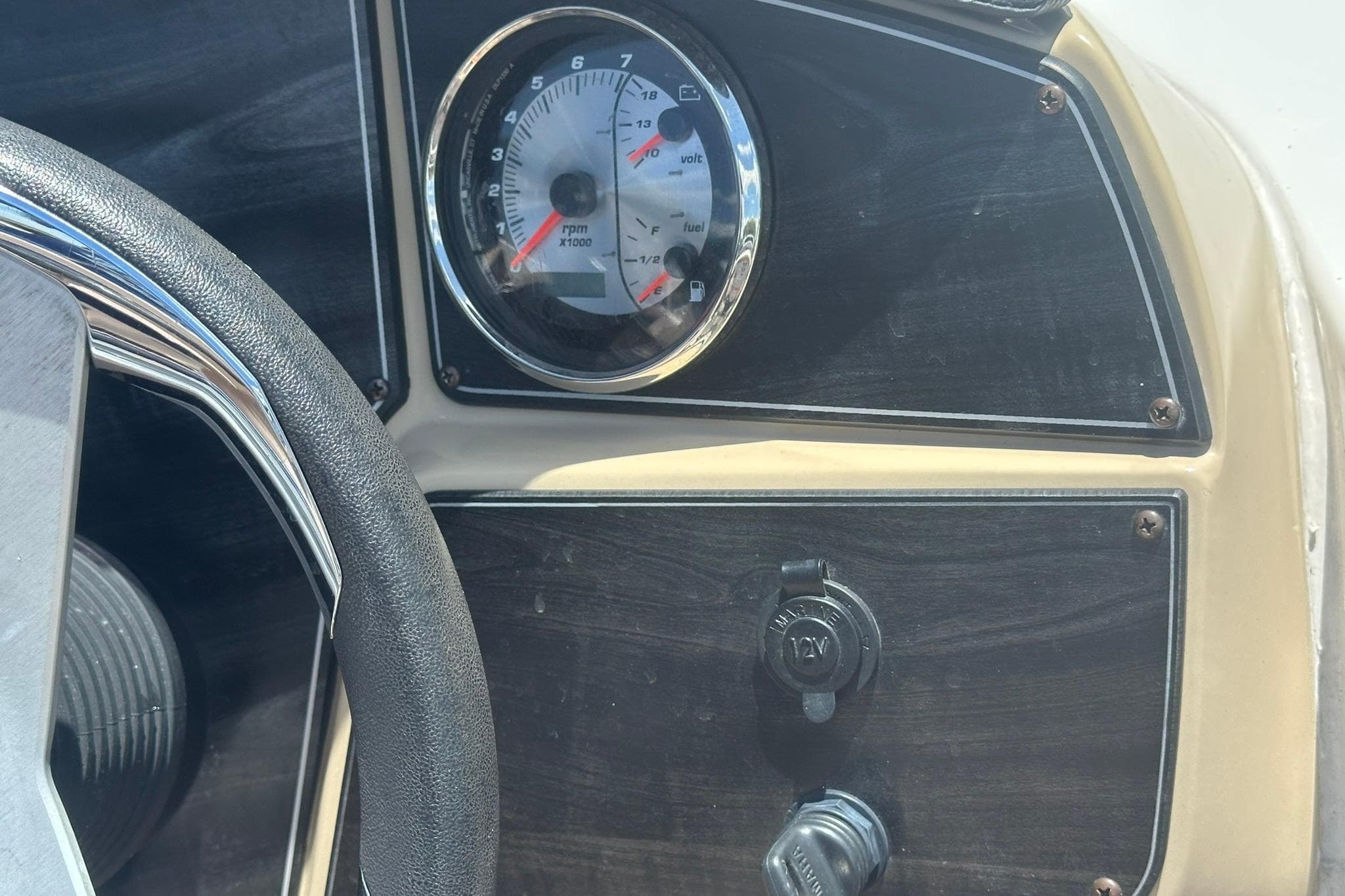 Steering wheel and dashboard of 2019 Hurricane Sundeck Sport 218 OB boat.