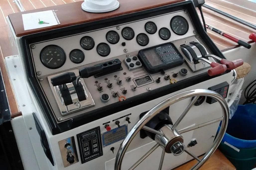 1989 Chris-Craft 381 Catalina boat dashboard with steering wheel and control panel.