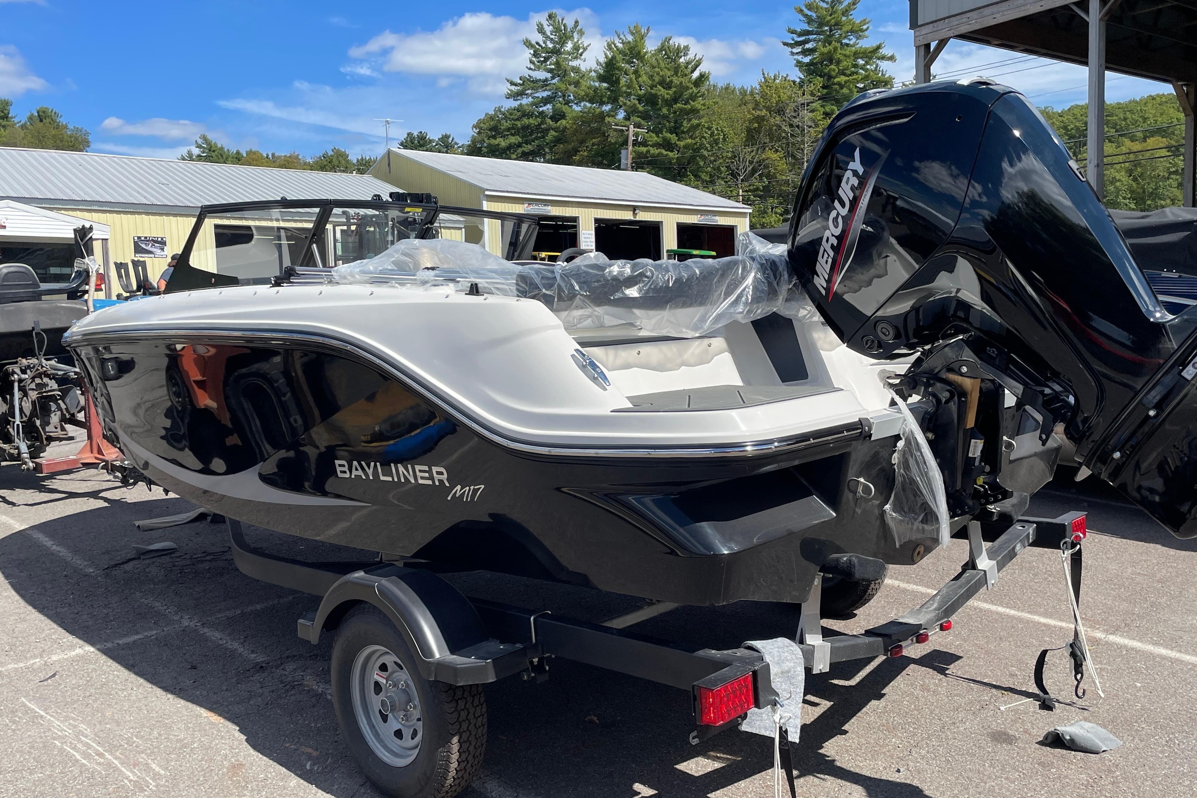 2026 Bayliner Element E17 boat with Mercury engine on trailer, outdoors.