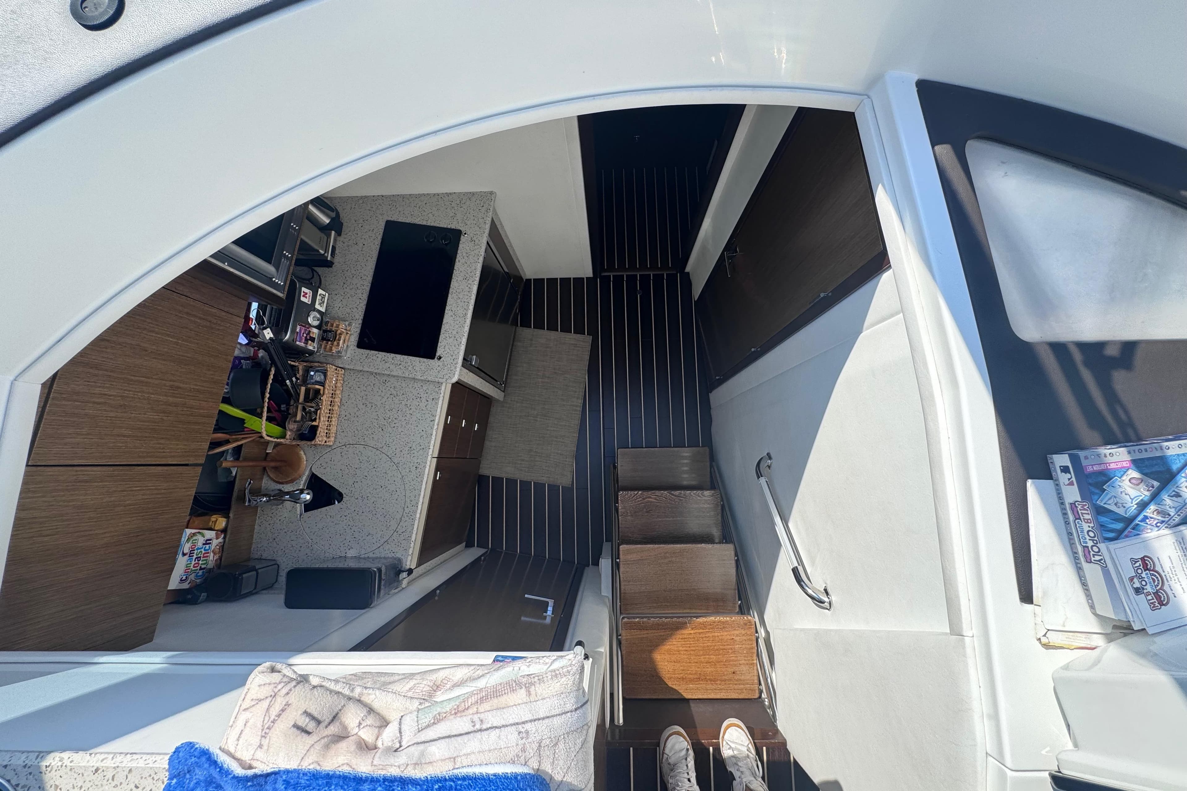 Interior view of 2012 Cruisers Yachts 41 Cantius, featuring modern kitchen and steps.