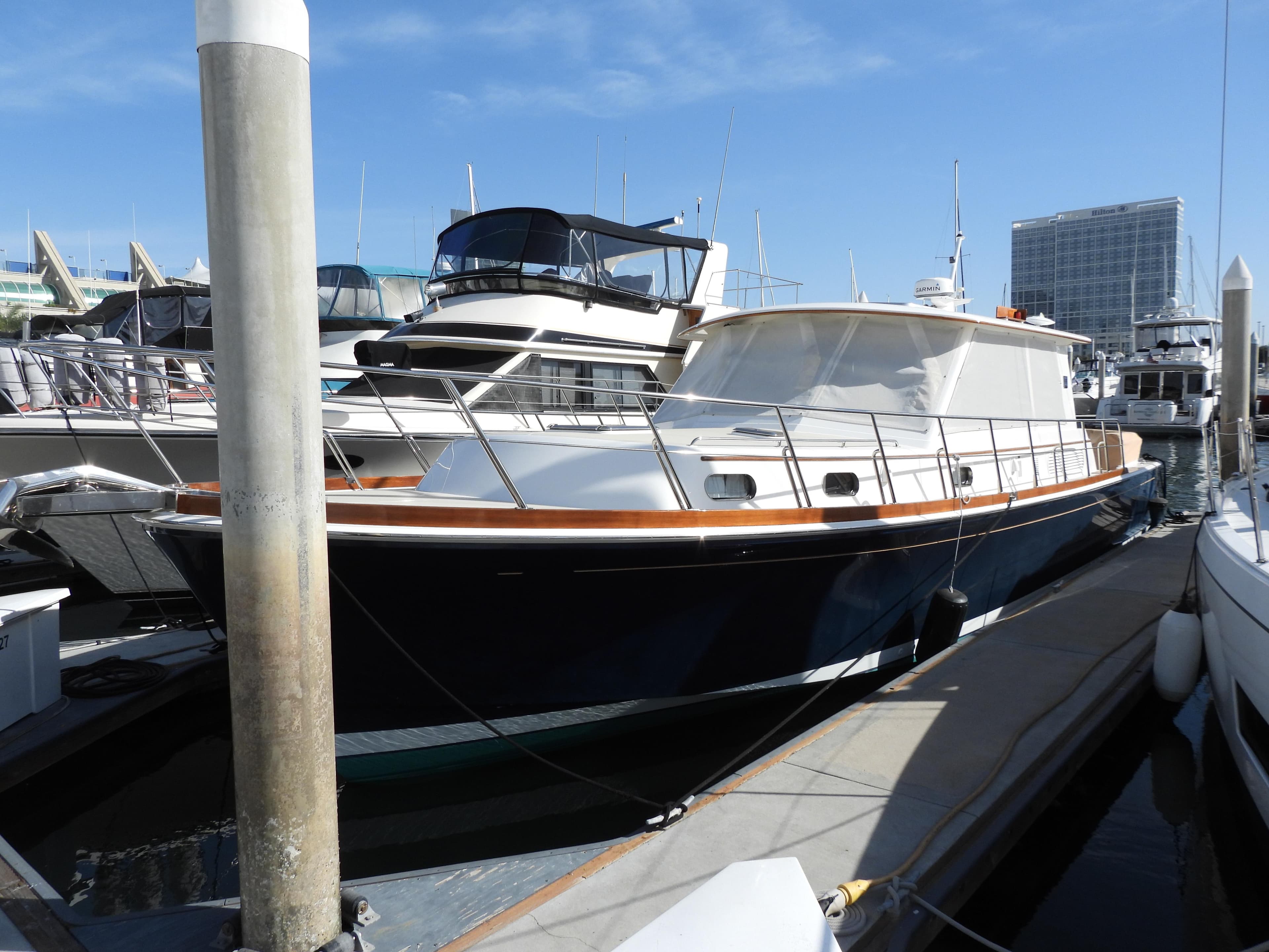 2015 Grand Banks 46 Eastbay SX yacht docked at marina.