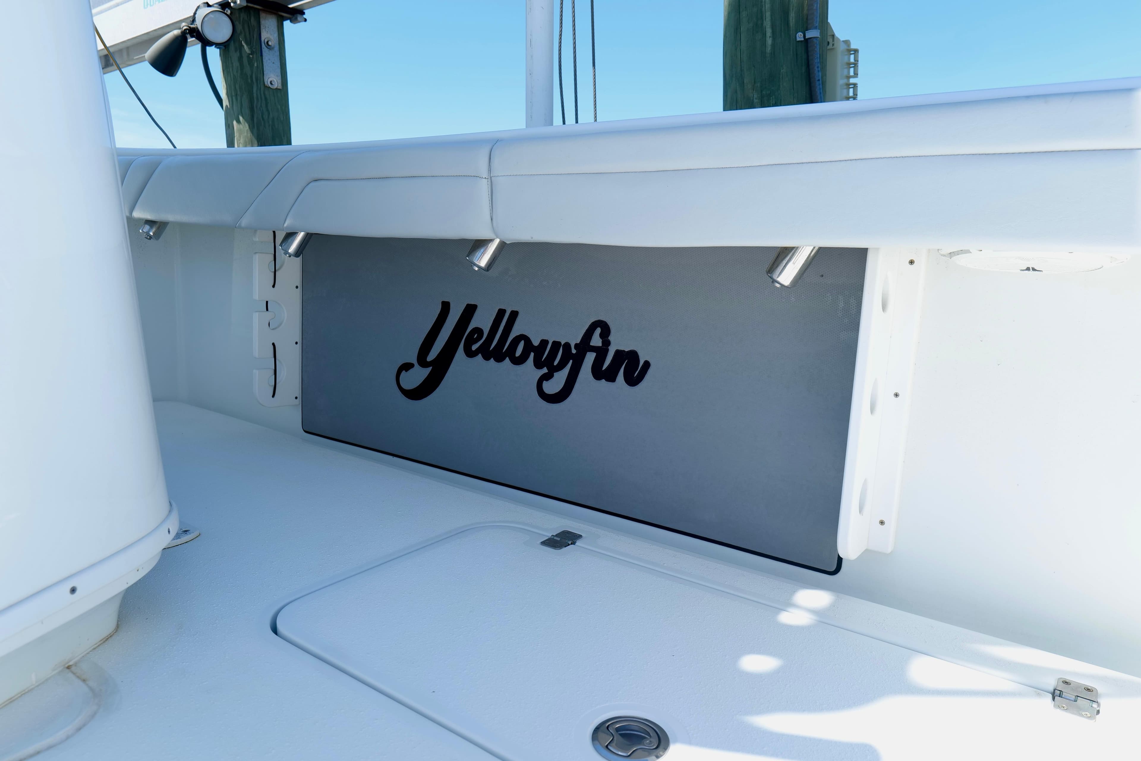 2018 Yellowfin 36 Offshore boat interior with logo, white seating, and clean design.