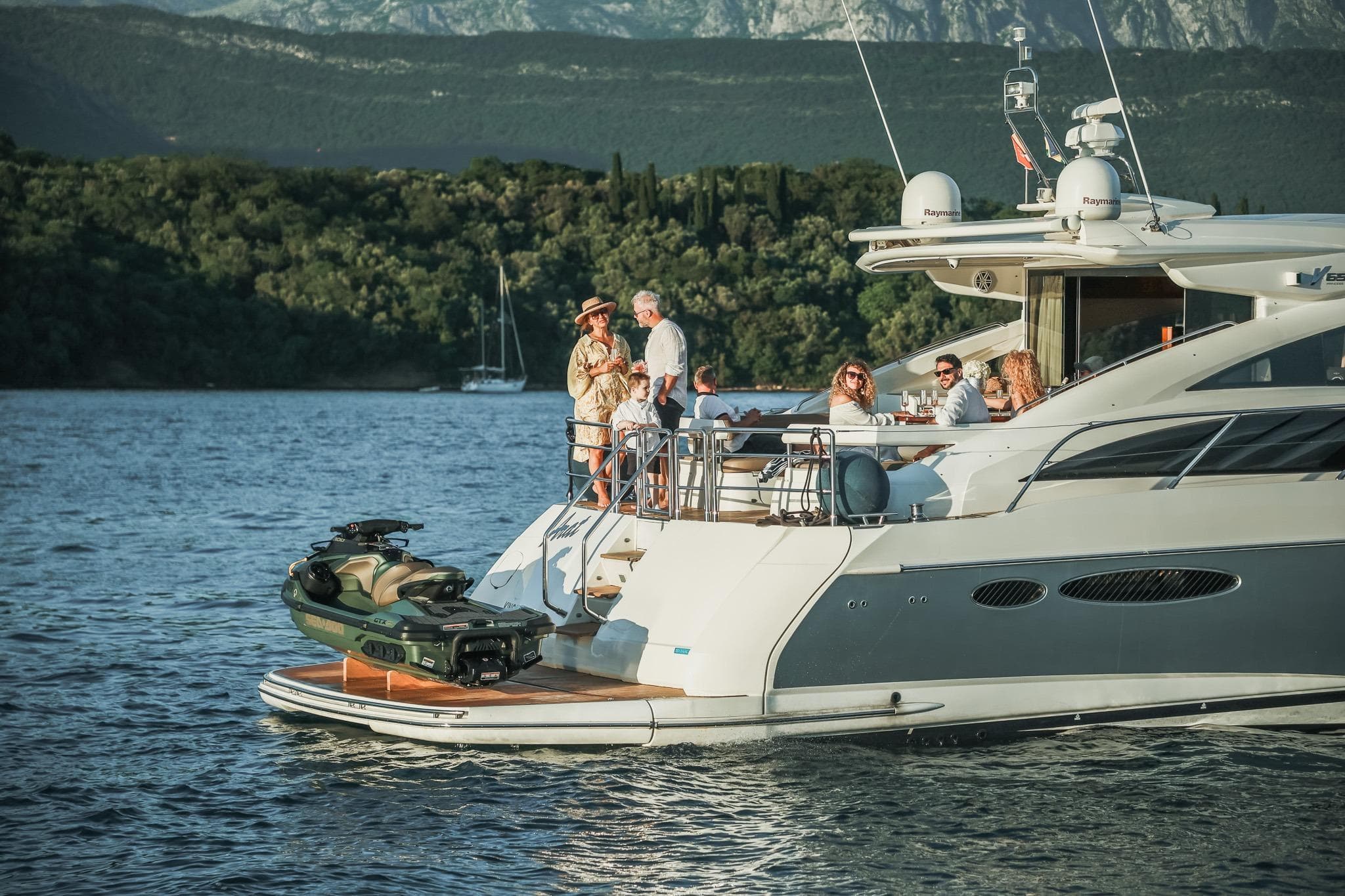 Luxury yacht Princess V65 cruising with passengers, scenic backdrop, 2008 model.