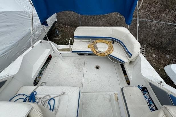 1993 Carver 280 Express boat interior with seating and storage compartments.