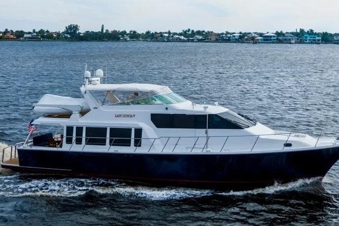 2000 Pacific Mariner 65 Motoryacht cruising on open water.