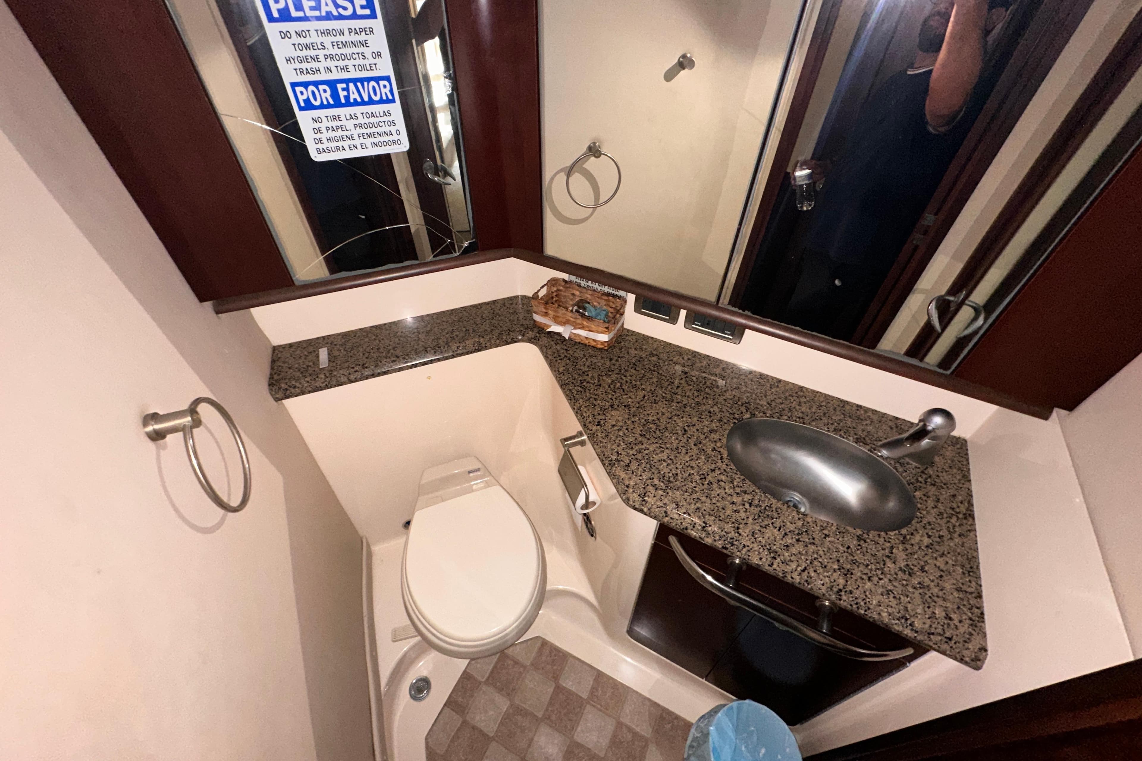 Bathroom interior of 2006 Sea Ray 58 Sedan Bridge yacht with granite countertop.