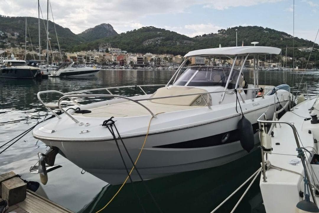 2012 Sessa Marine Key Largo 34 docked in a scenic marina setting.