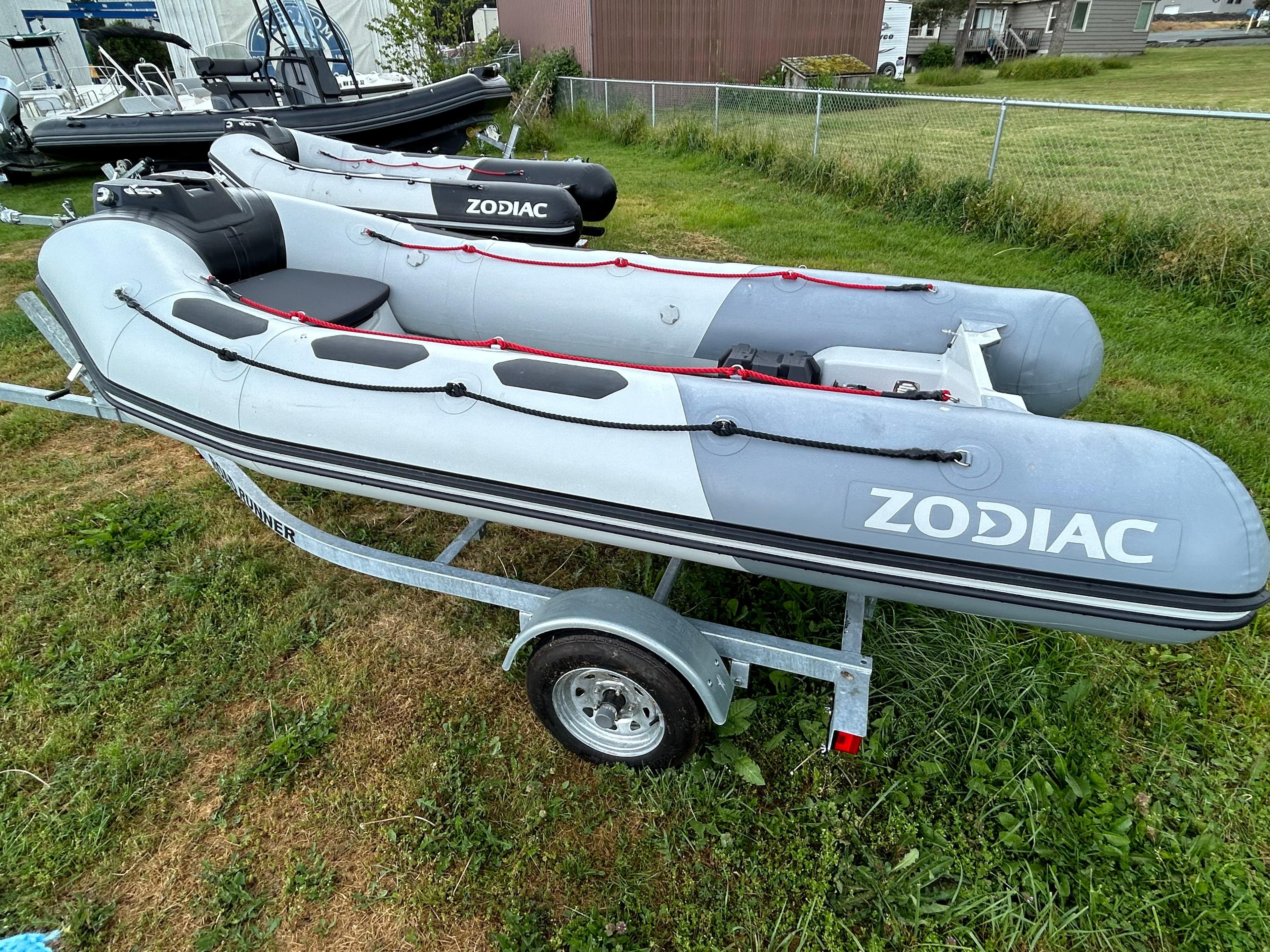 2023 Zodiac Open 3.4 inflatable boat on a trailer, displayed outdoors.