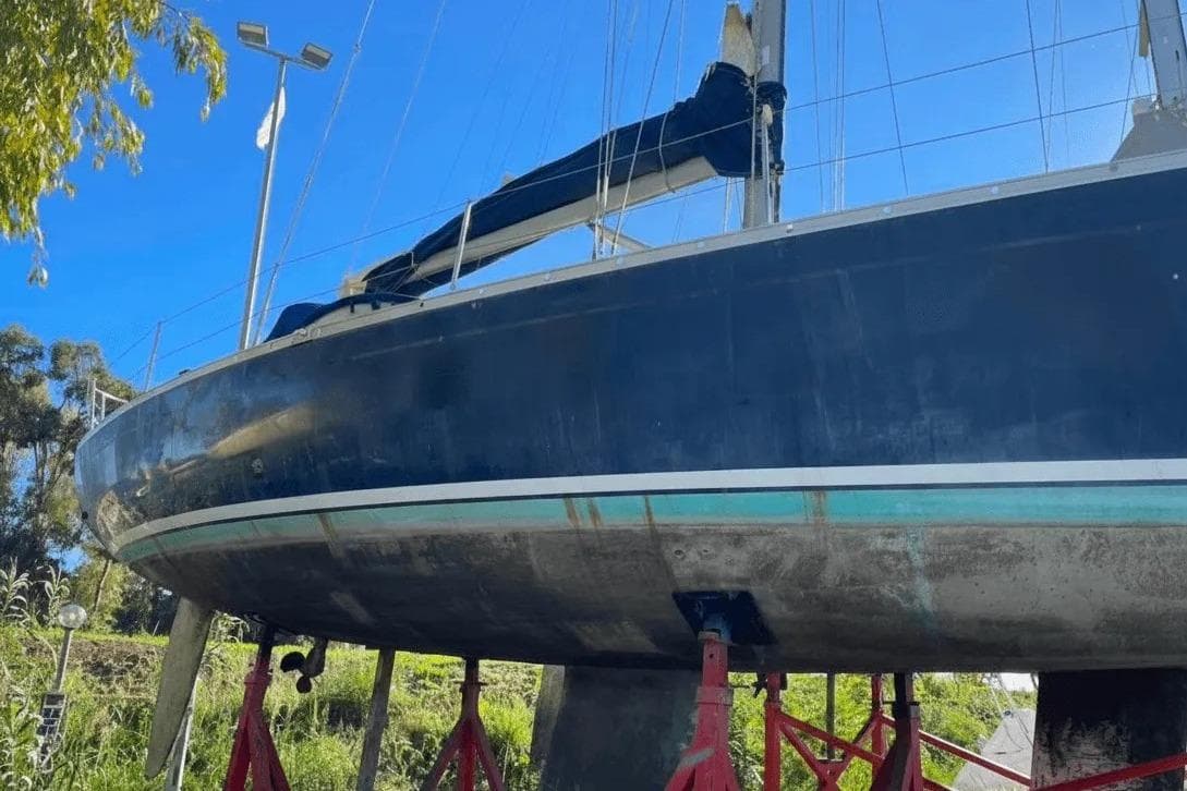 2003 Cantiere del Pardo Grand Soleil 43 sailboat on stands, blue hull, outdoor setting.