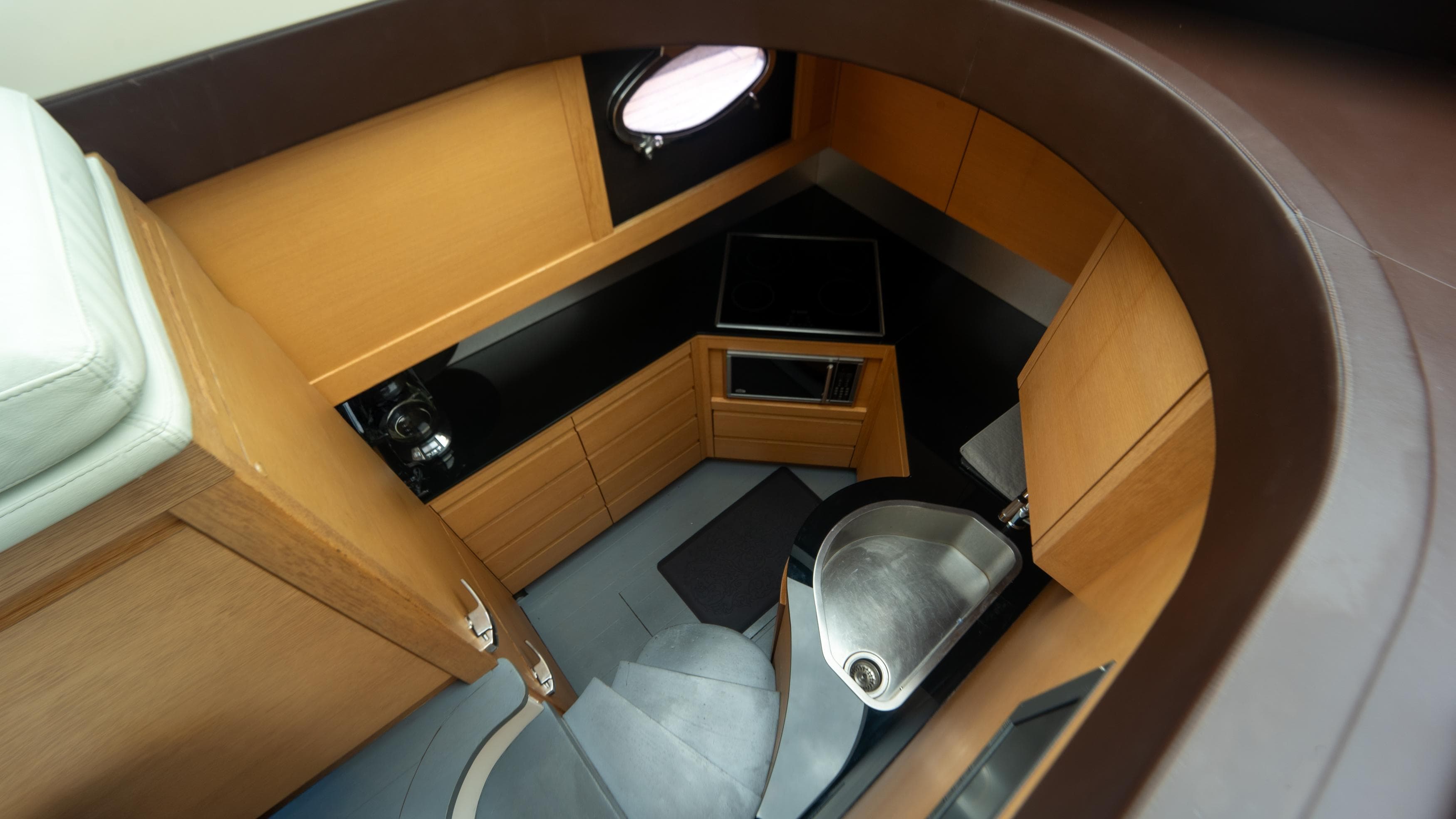 Interior of 2009 Pershing 64 yacht, featuring modern kitchen and sleek design elements.