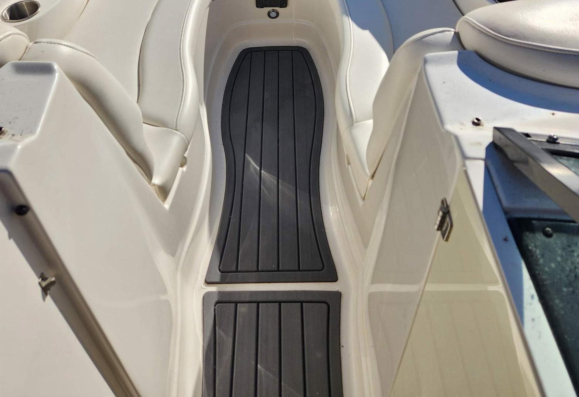 2013 Monterey 264FSX boat interior with sleek seating and non-slip flooring.