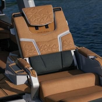 Luxurious seating on Nautique G25 Paragon MY2026 boat, featuring elegant tan upholstery.