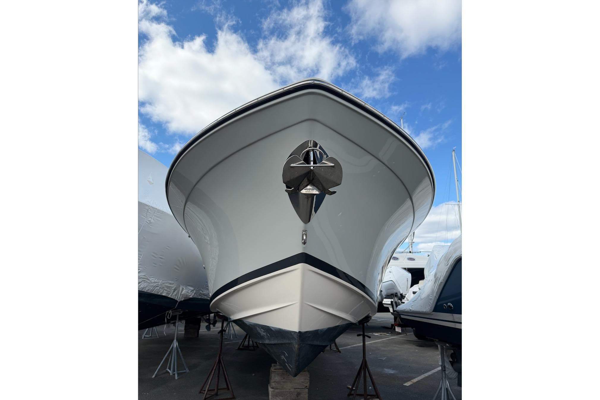 2020 Grady-White Freedom 285 boat on stands under a blue sky.