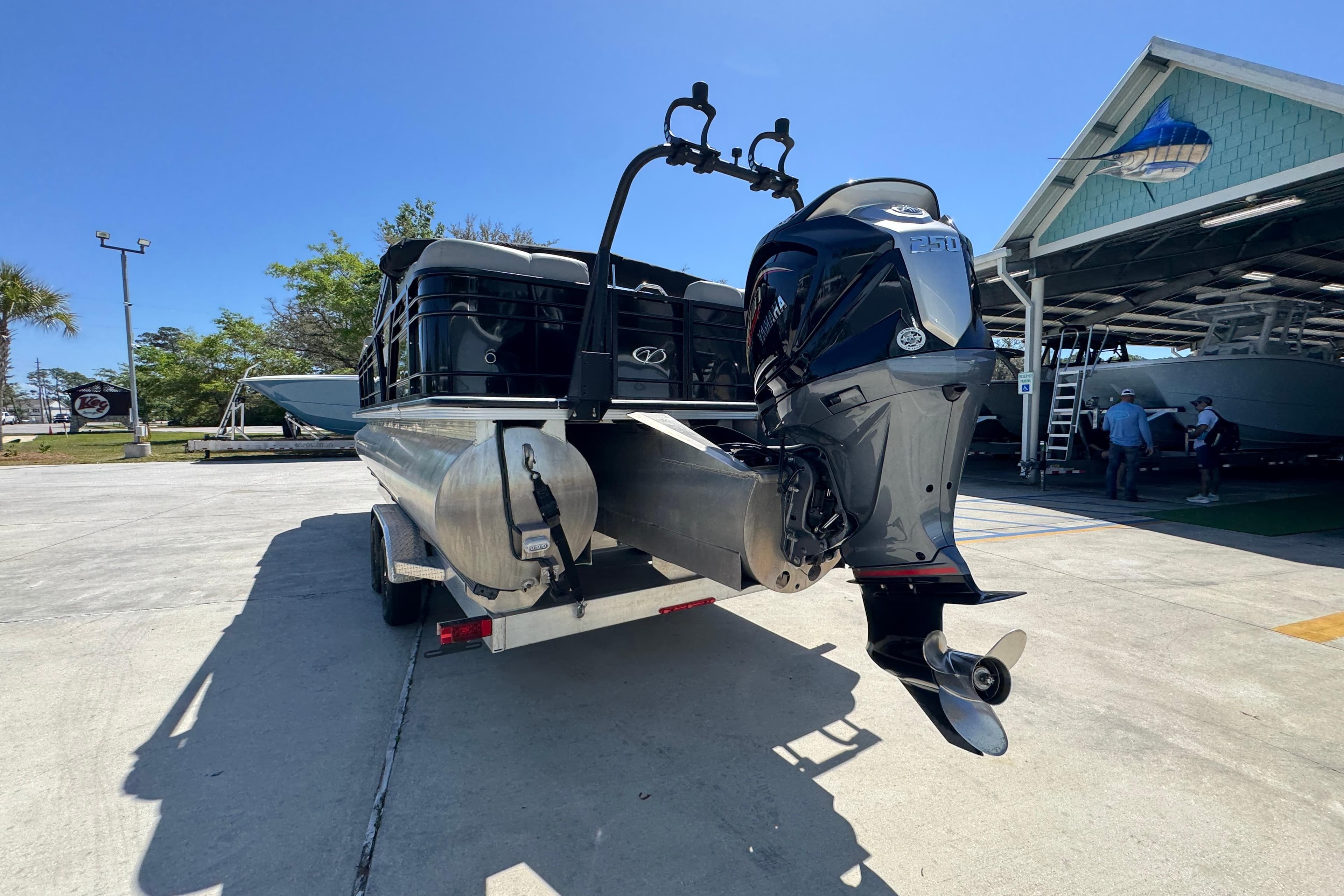 2023 Veranda VTX 25RC pontoon boat with powerful outboard motor on a trailer.