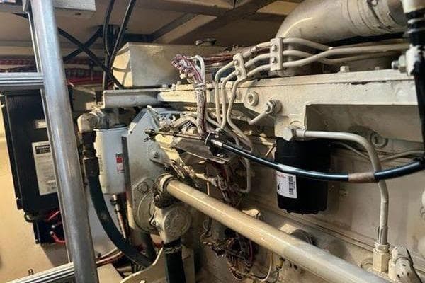 Engine room of 2000 Grand Banks 36 Classic yacht, showcasing mechanical components and wiring.