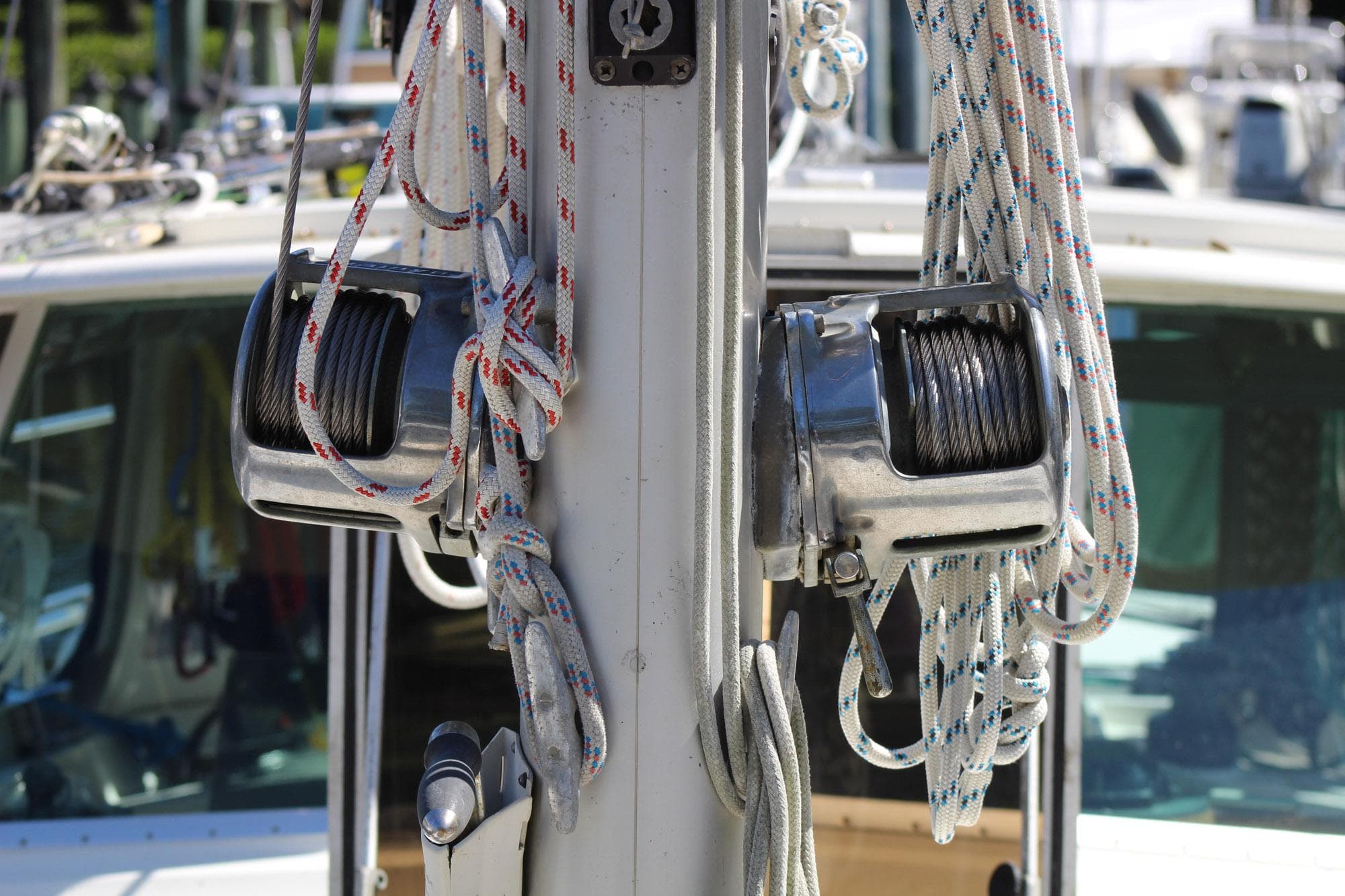 1974 Camper & Nicholsons Center Cockpit sailboat mast with winches and ropes.