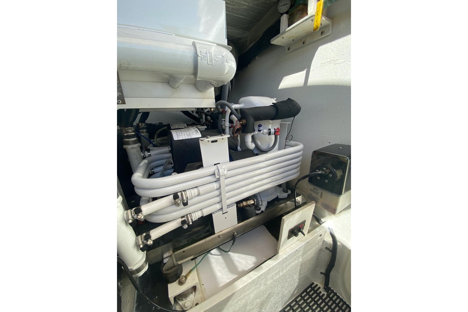 Engine room of 2006 North Star Yachts 73 Cockpit Motoryacht, showcasing mechanical components.