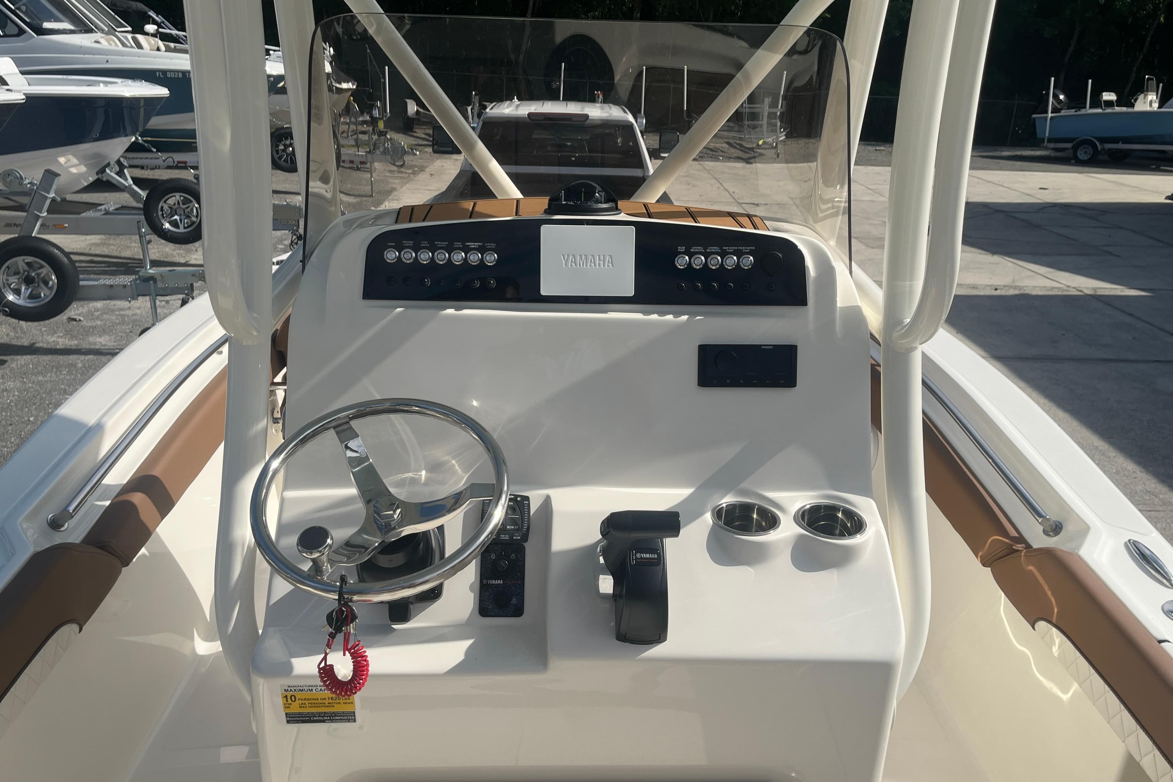 2026 Pioneer 222 Islander boat dashboard with steering wheel and controls.